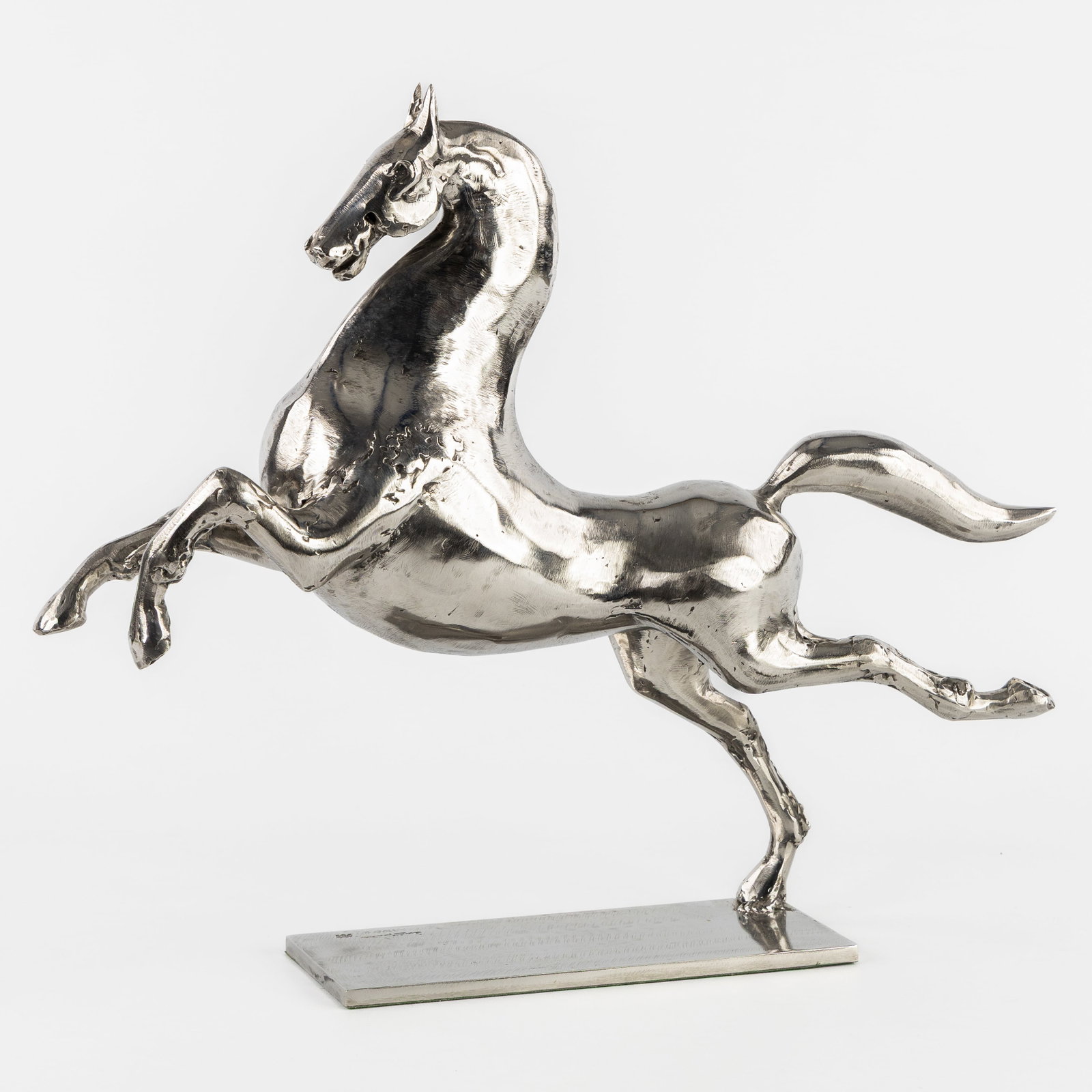 Lievin van Outryve d'Ydewalle (1937) 'Leaping Horse', Stainless steel.: Lieven van Outryve d'Ydewalle (1937) 'Leaping Horse', Stainless steel. Sculpture of a leaping horse. Stainless steel. Unique piece. Signed on the base. Dimensions: (W:48 x H:40 x