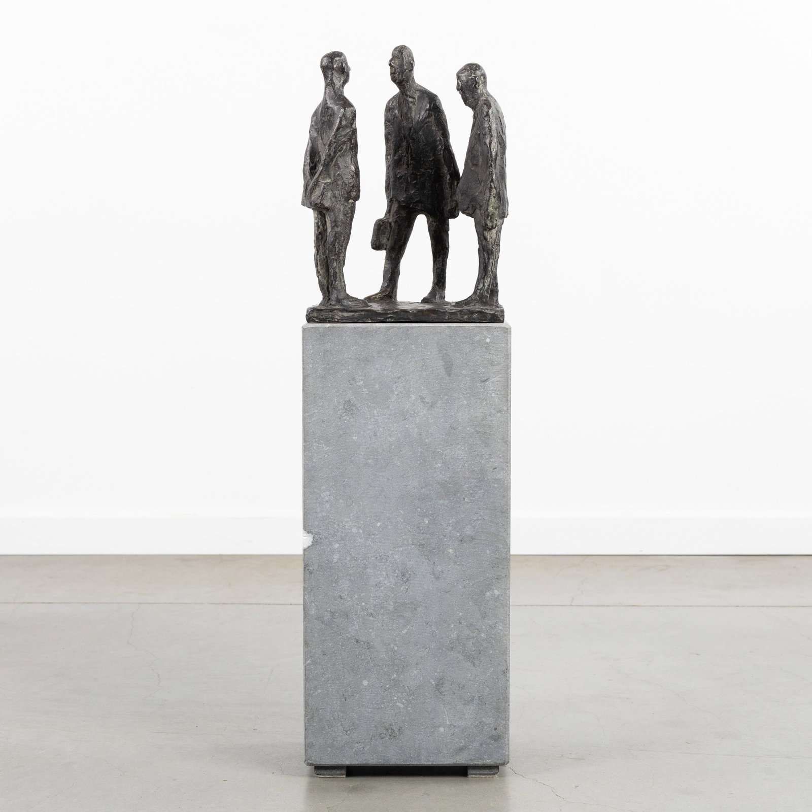 Bert Kiewiet (1918-2008) 'Three Men in Conversation', patinated bronze, mounted on a bluestone (1 of 9)