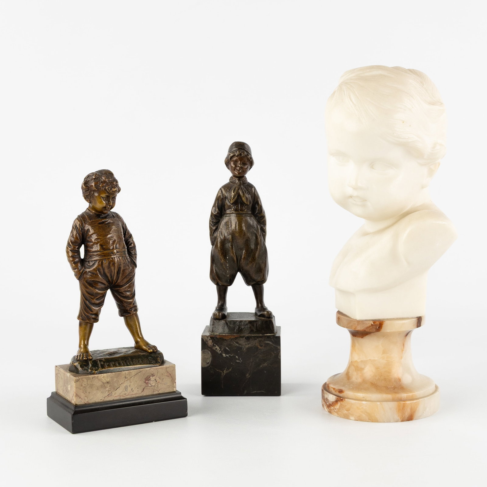 Paul Schmidt-Felling (1835-1920), R. Höbold (XIX-XX) and Duquesnoy (XIX-XX), two bronze figurines: Paul Schmidt-Felling (1835-1920), R. Höbold (XIX-XX) and Duquesnoy (XIX-XX), two bronze figurines and an alabaster bust. Paul Schmidt-Felling (1835-1920) 'Dutch Farm Boy'Patinated bronze, mounted on 