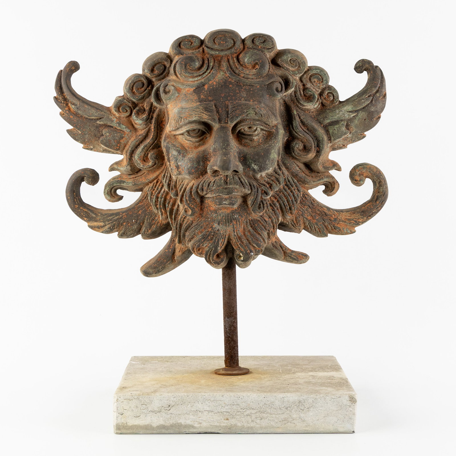 A Bronze sculpture of a Grotesque or Bust of Neptune, mounted on a natural stone base. (1 of 6)