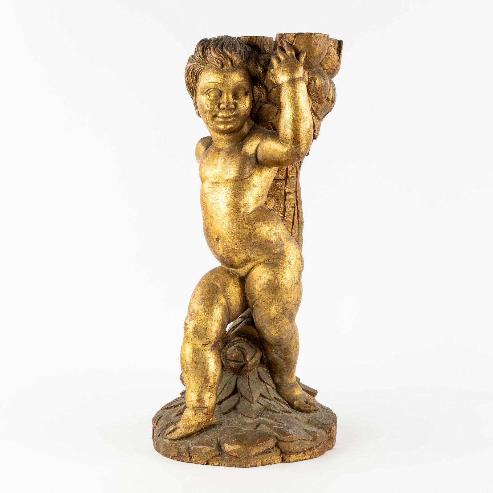 A Decorative sculpture of a Putto, gilded wood, Baroque style. (1 of 8)