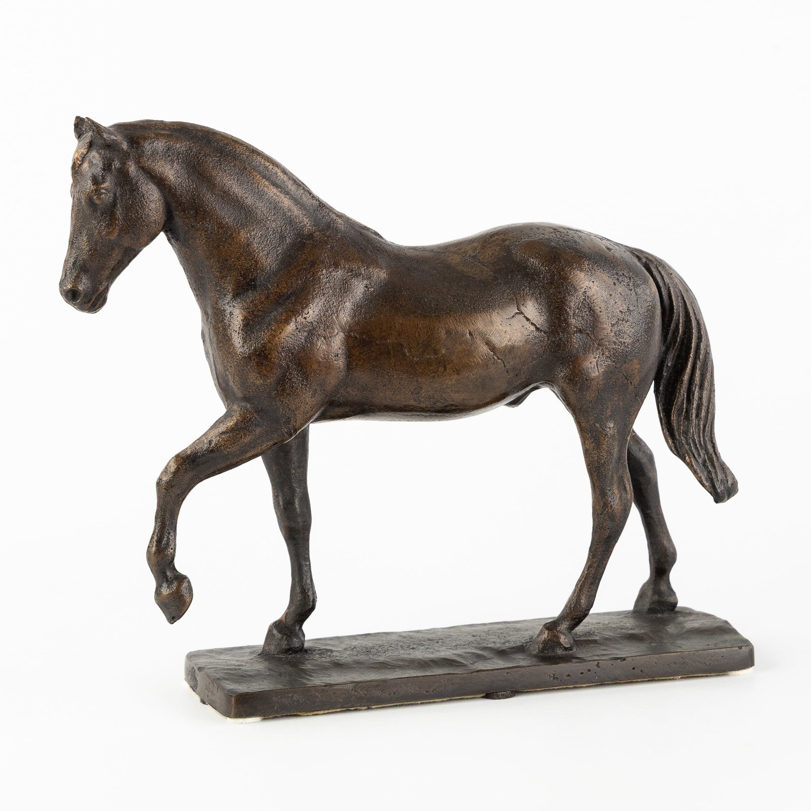 A Sculpture of a Horse, patinated bronze.: A Sculpture of a Horse, patinated bronze. Patinated bronze.Unsigned. Dimensions: (W:24 x H:20,5 x L:7 cm) The absence of a condition report does not imply a perfect item. Please send us an e-mail to r