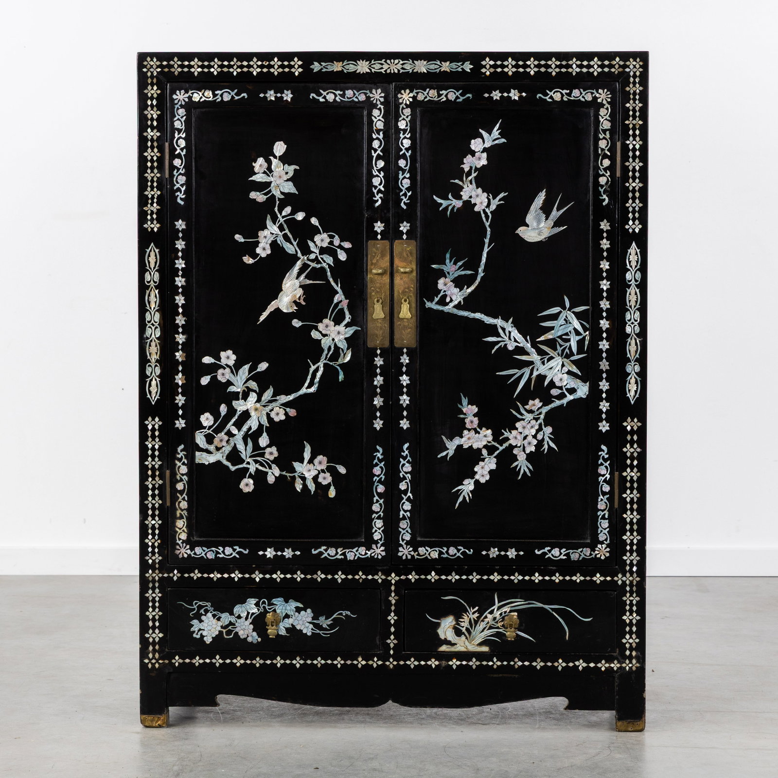 A Black lacquered Chinese cabinet, decorated with mother-of-pearl inlay. 20th C. (1 of 7)
