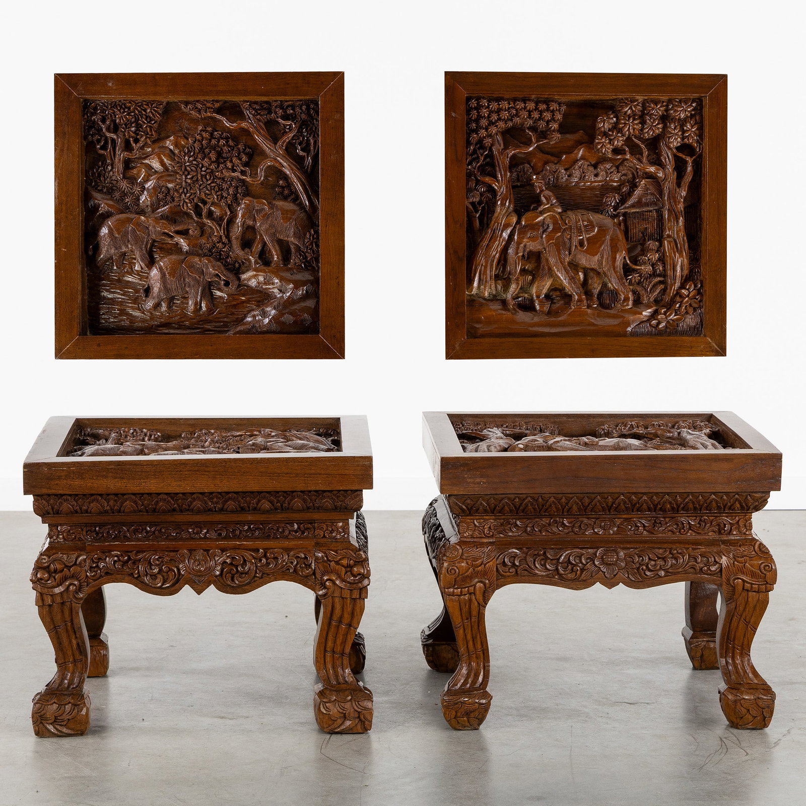 A Pair of richly sculptured Oriental side tables with elephant decoration, 20th C. (1 of 9)