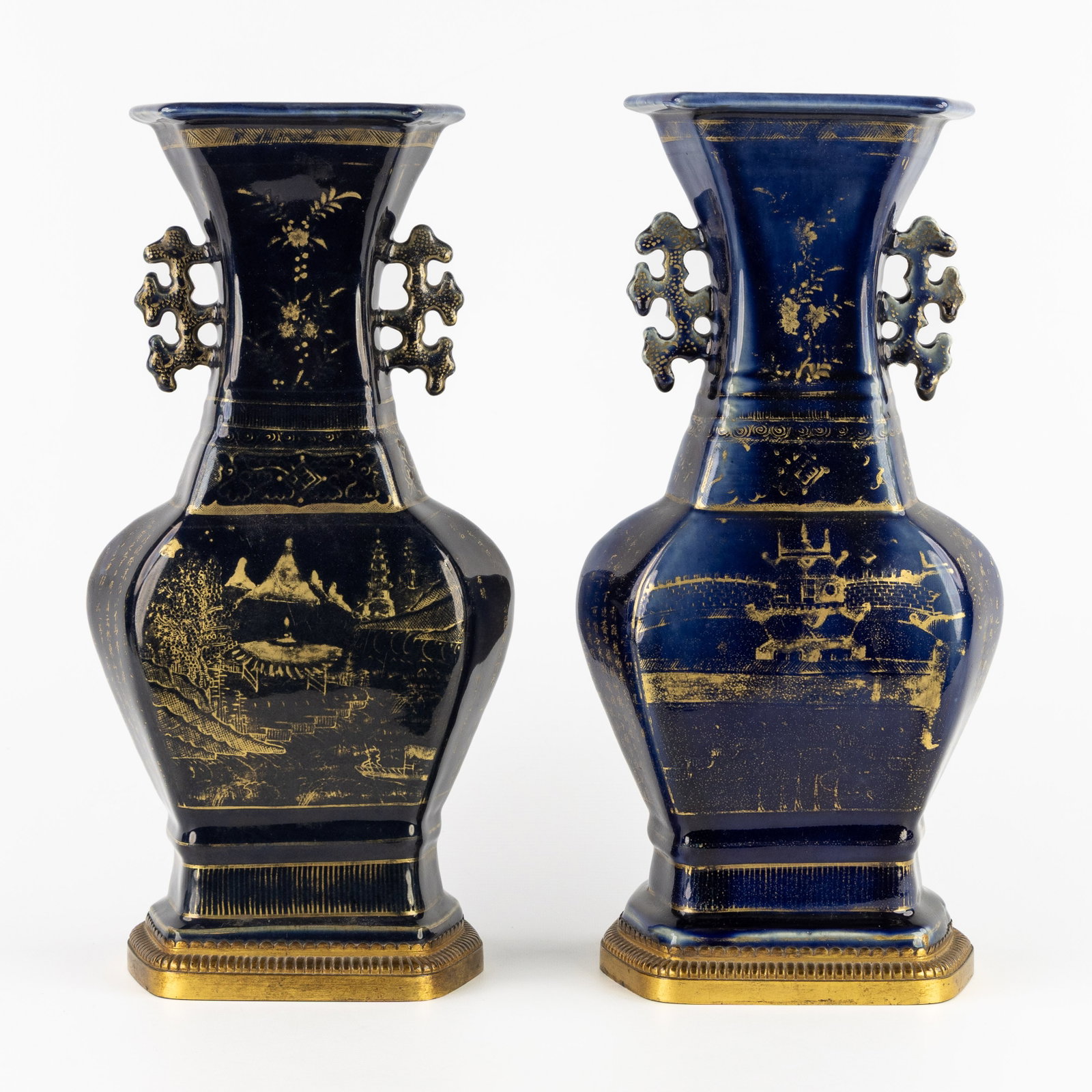 A pair of hexagonal Chinese vases, blue ground with gilded decoration, standing on a bronze base. 19 (1 of 7)