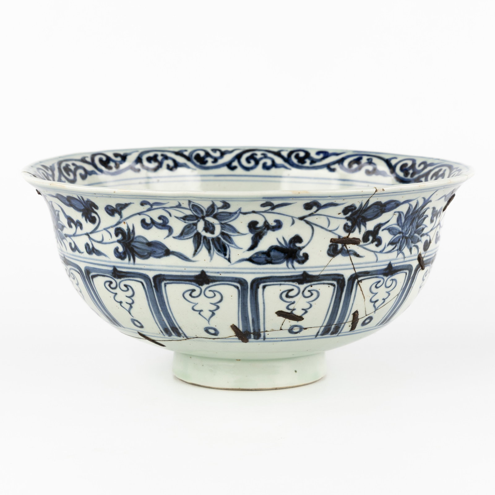 A large Chinese blue-white bowl, probably Ming. With old restorations. (1 of 9)