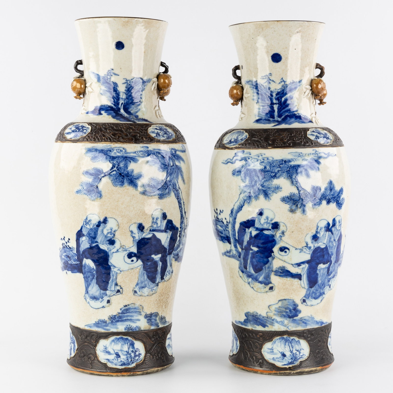 A Pair of Chinese vases, blue and white decor of Wise Men with a Scroll, finished with pomegranates,: A Pair of Chinese vases, blue and white decor of Wise Men with a Scroll, finished with pomegranates, Nanking, 19th century. Chinese porcelain.Blue and white decoration of wise men with a scroll, in a 