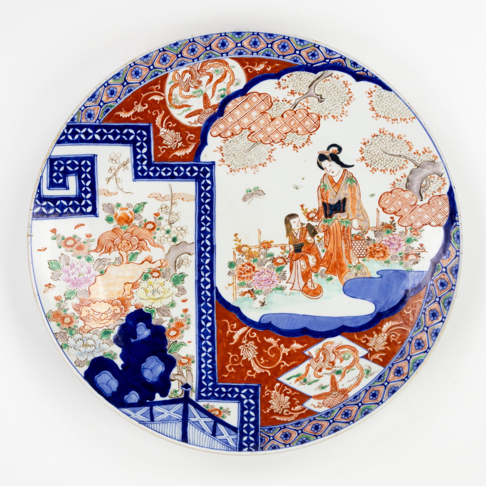 A Large Japanese Imari plate, Edo/Meiji, 18th/19th C.: A Large Japanese Imari plate, Edo/Meiji, 18th/19th century. Imari porcelain.Decorated with a figurative scene and a Shishi or Komainu. Dimensions: (W:55 cm) The absence of a condition report does not 