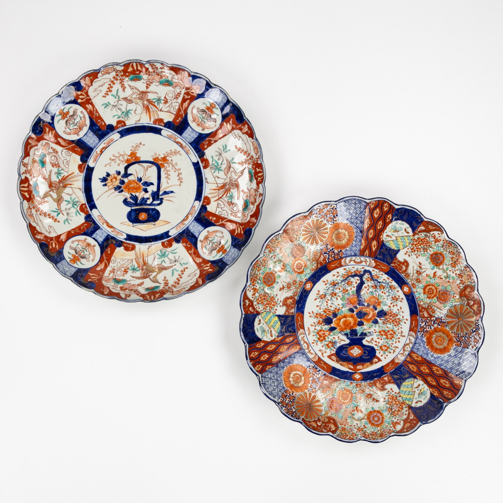 Two Large Japanese Imari plates, Edo/Meiji, 18th/19th C.: Two Large Japanese Imari plates, Edo/Meiji, 18th/19th century. Imari porcelain.Florally decorated with birds and flower vases. Dimensions: (W:46 cm) The absence of a condition report does not imply a 