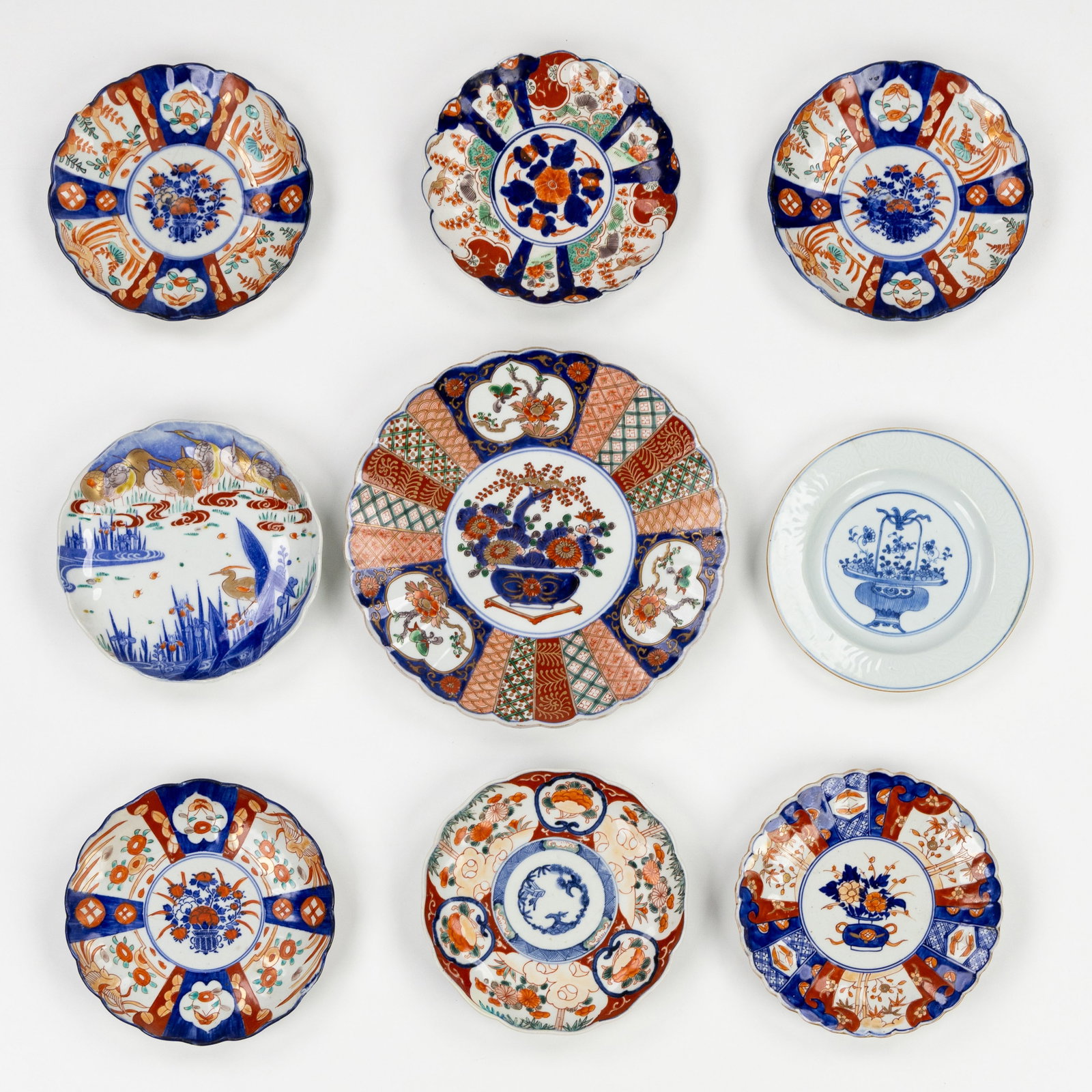 Nine Chinese and Japanese Imari and Blue-and-white plates, 18th/19th C.  (1 of 4)