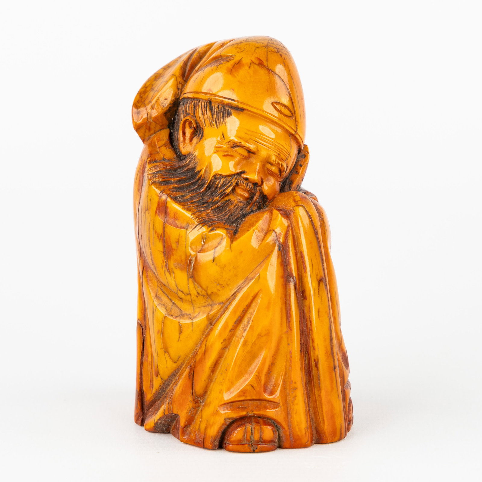 A Chinese sculpture of a sage or scholar, sculptured mammoth ivory, China, 19th C. (1 of 7)