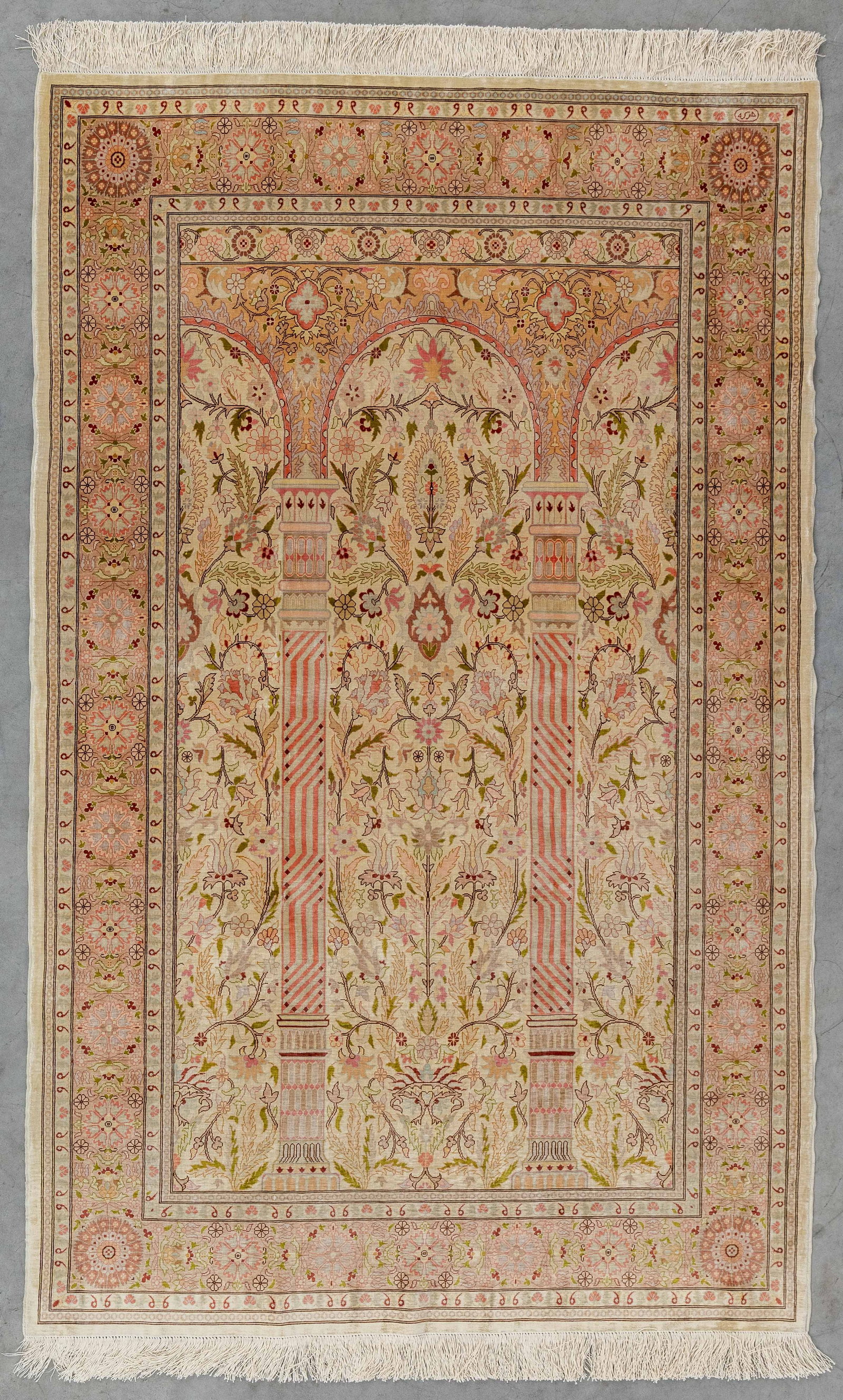 An Oriental hand-made carpet, silk. Hereke, Turkey. Finished with gold thread. (151 x 103 cm) (1 of 5)