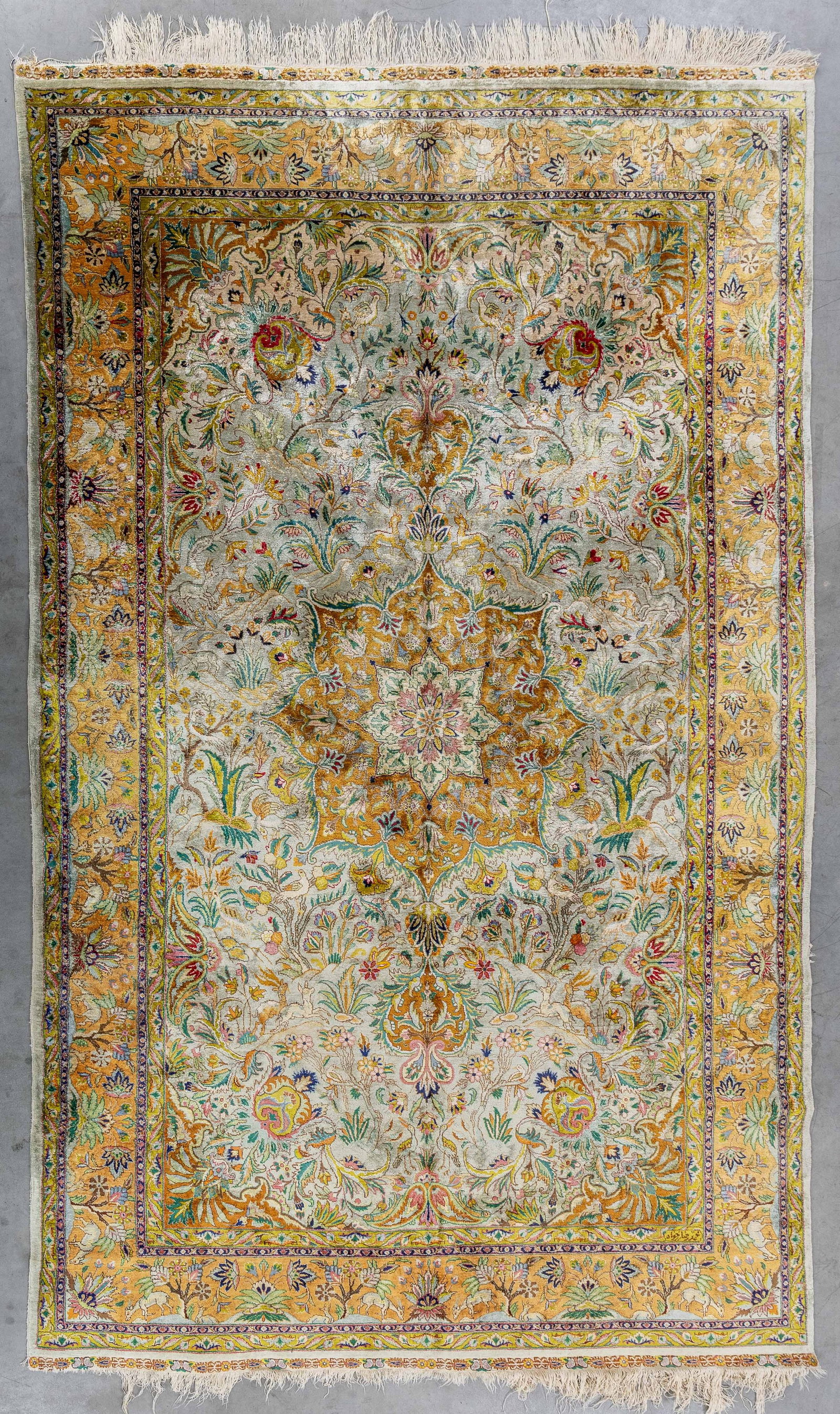 An Oriental hand-made carpet with figurative decor, silk, with wall bracket. (283 x 173 cm) (1 of 5)