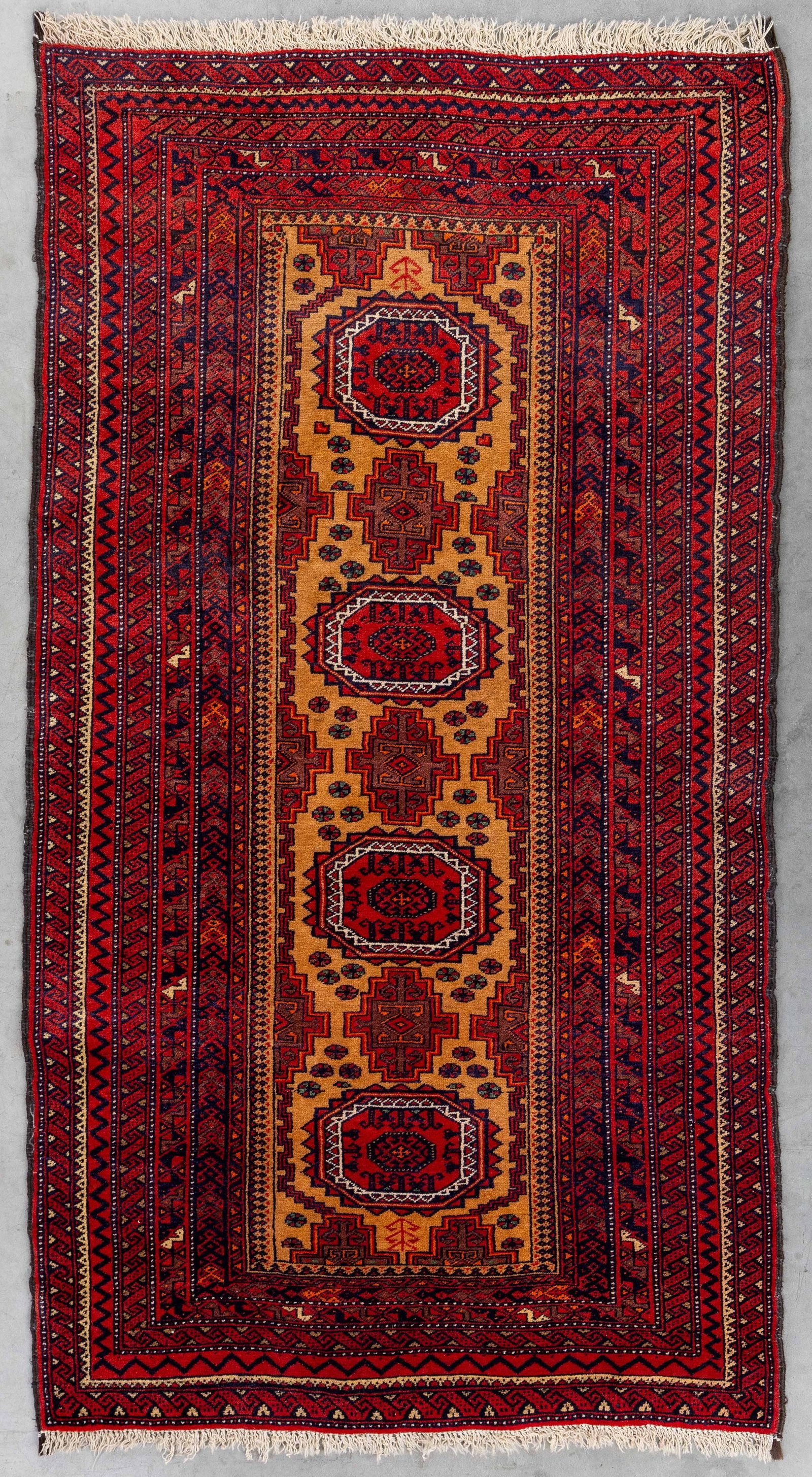 An Oriental hand-made carpet, Zabol, Iran (197 x 97 cm).: An Oriental hand-made carpet, Zabol, Iran (197 x 97 cm). Dimensions: (W:97 x H:197 cm) The absence of a condition report does not imply a perfect item. Please send us an e-mail to request a condition 