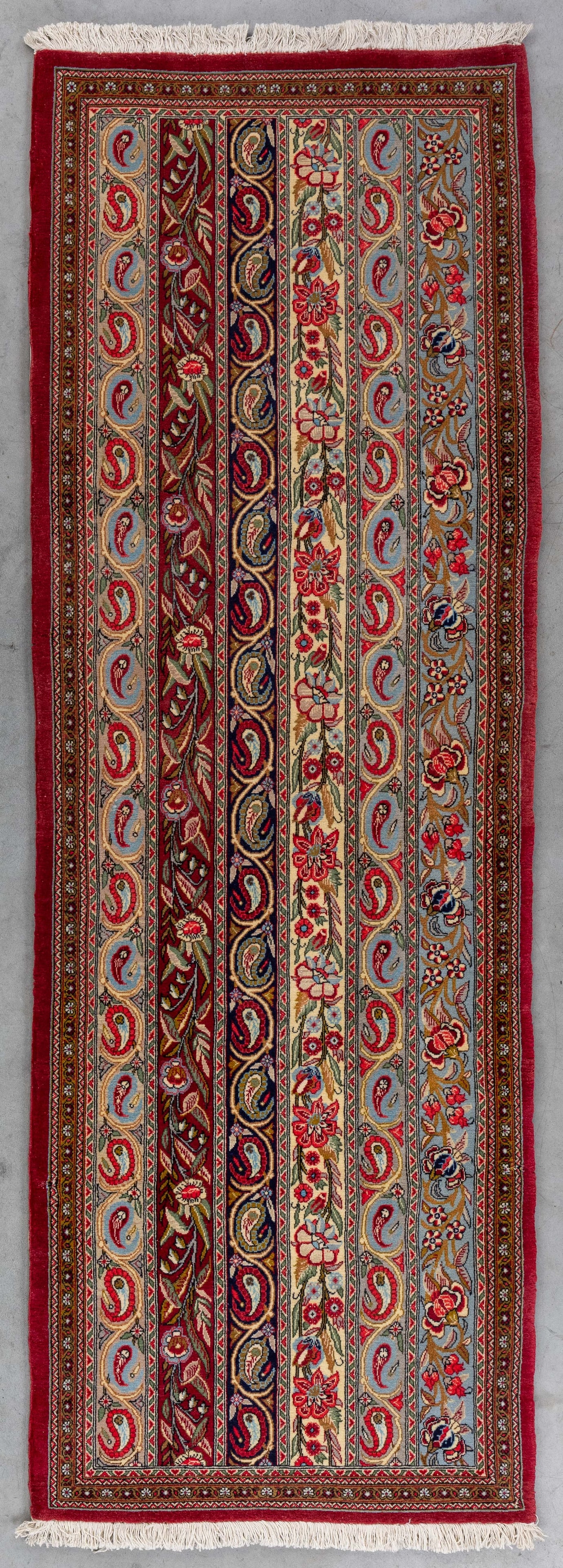 An Oriental hand-made carpet, Ghoum, Iran (194 x 67 cm). (1 of 4)