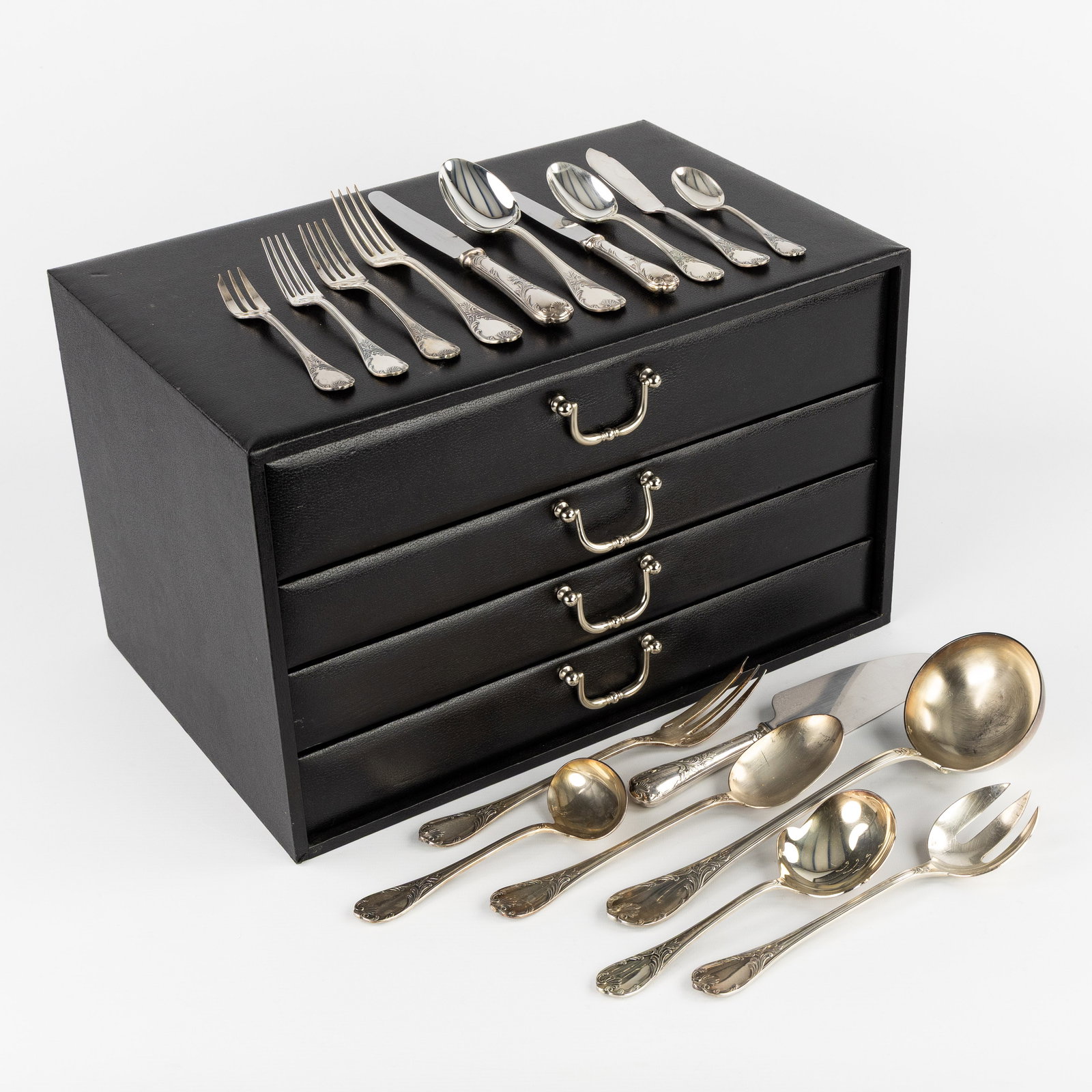 Christofle, Marly, a 128-piece silver-plated cutlery in a chest with 4 drawers. : Christofle, Marly, a 128-piece silver-plated cutlery in a chest with 4 drawers. 12 large knives. 12 large forks12 large spoons 12 ice cream spoons12 oyster forks12 fish knives (4 new in their packagin