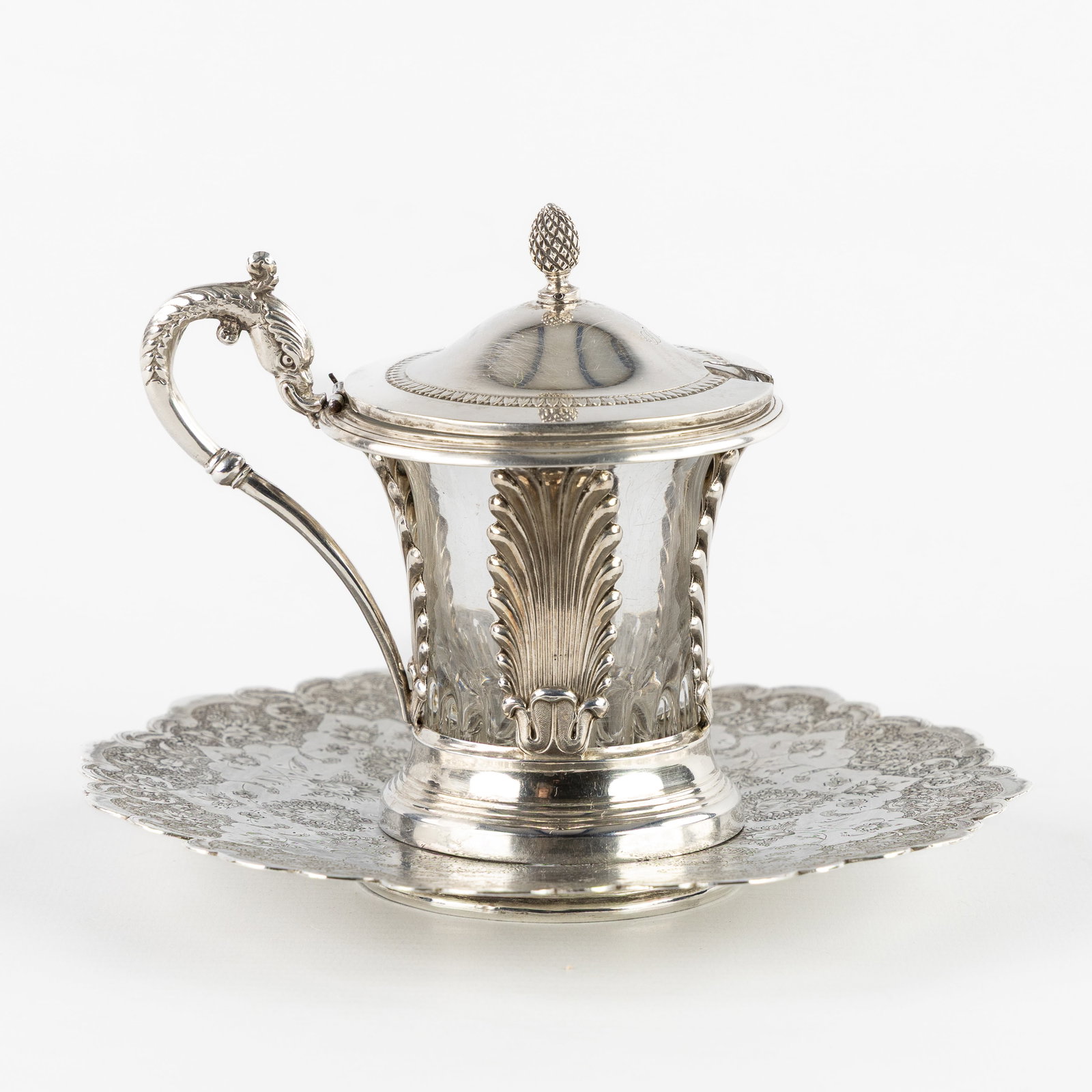 A Silver Persian dish or vide-poche, and a French mustard pot, silver and glass. Silver, 308g. (1 of 11)