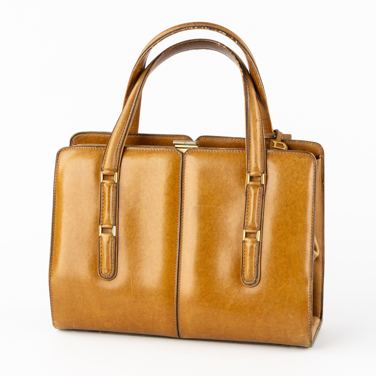 Delvaux, a vintage cognac leather handbag.: Delvaux, a vintage cognac leather handbag. Cognac leather.Marked 'Delvaux - Modele Déposé'. Dimensions: (W:28 x H:33 x L:9 cm) The absence of a condition report does not imply a perfect item