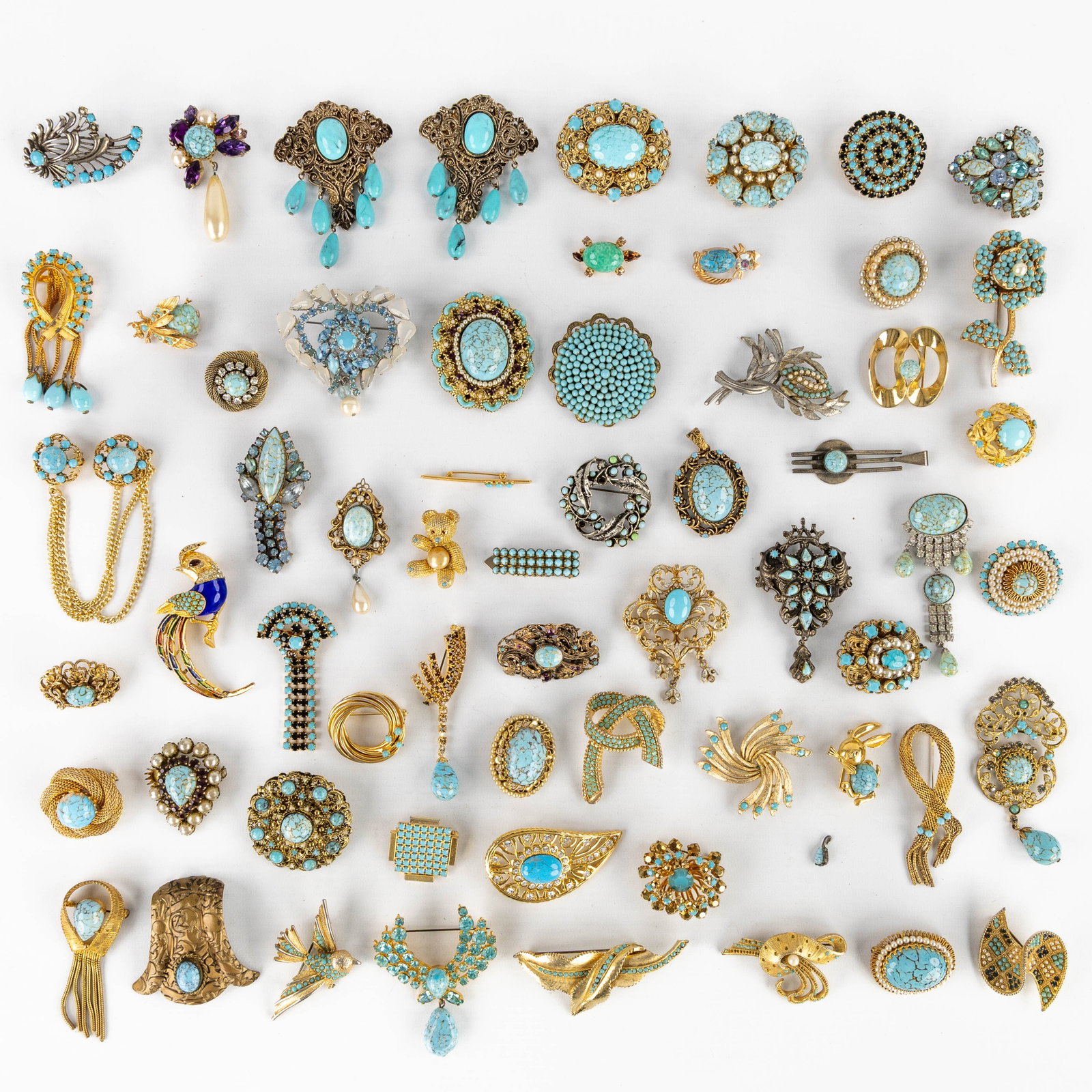 Costume Jewellery: Brooches. circa 62 pieces. Silver-plated and gold-plated metal, with turquoise in (1 of 5)