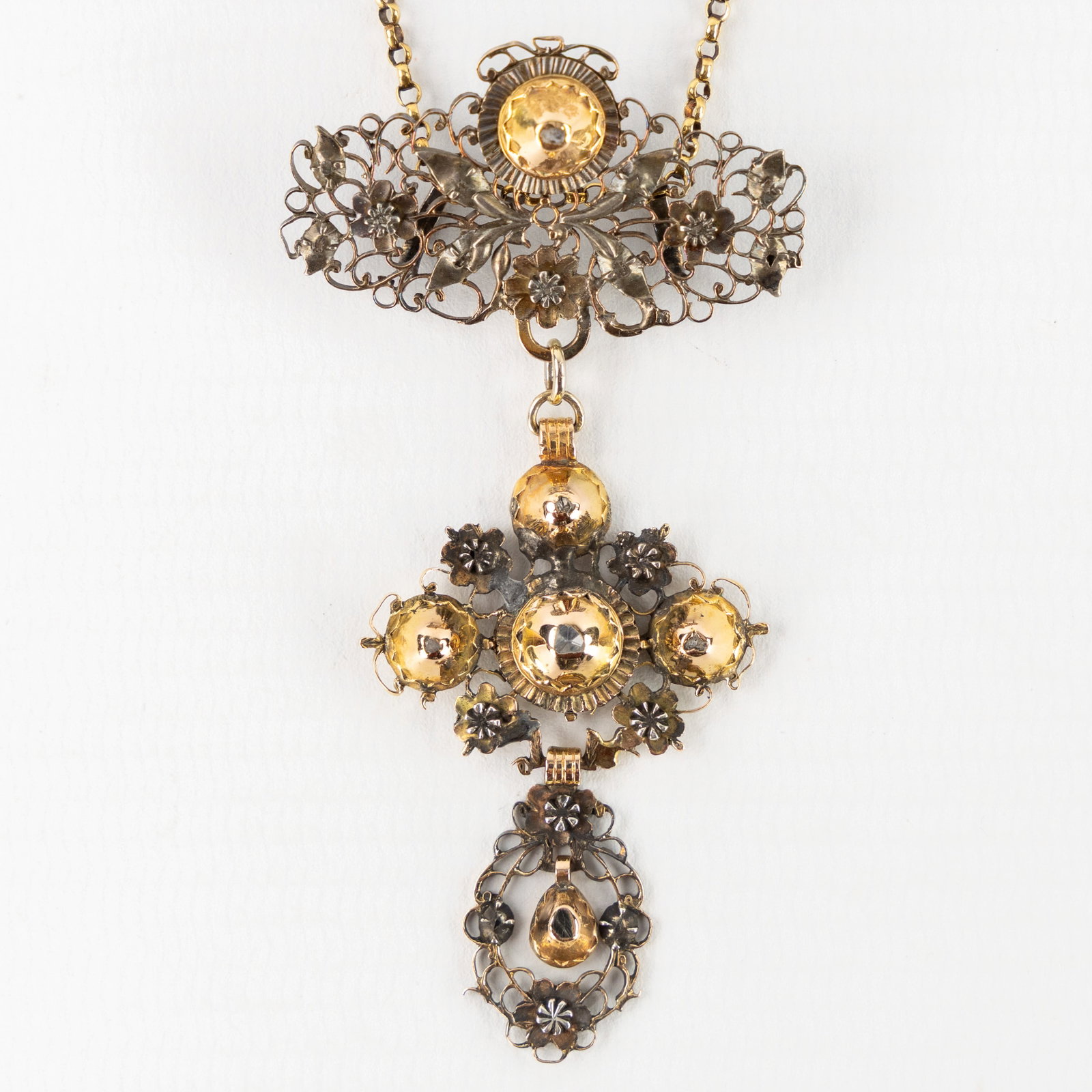 An antique necklace with pendant, finished with ‘Old Cut’ diamonds, Flanders. 19th C. 12: An antique necklace with pendant, finished with ‘Old Cut’ diamonds, Flanders. 19th C. 12.50g. Tested 18ct yellow gold.Unmarked. Finished with diamonds in an “Old Cut”