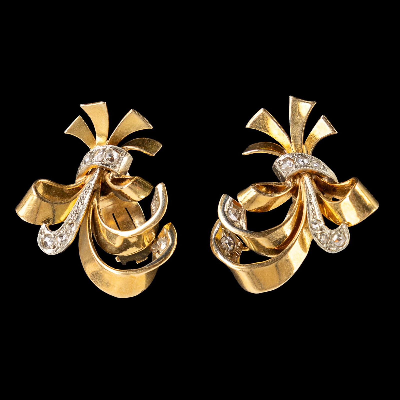 A pair of earrings, 18kt white and yellow gold. Set with old cut diamonds. 8.47g.: A pair of earrings, 18kt white and yellow gold. Set with old cut diamonds. 8.47g. A pair of gold earrings, set with old cut diamonds. Total gross weight: 8.47g. Marked 18kt. Dimensions: (W:2,3 x