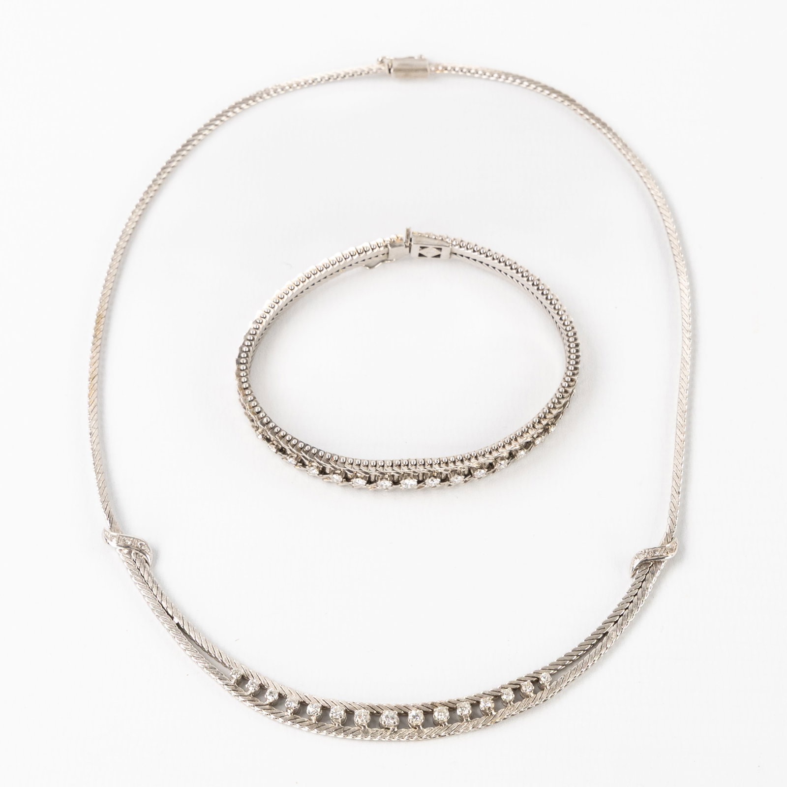 Jewellery, a bracelet and necklace, 14ct and 18ct white gold, set with brilliant-cut diamonds. 22,10 (1 of 9)