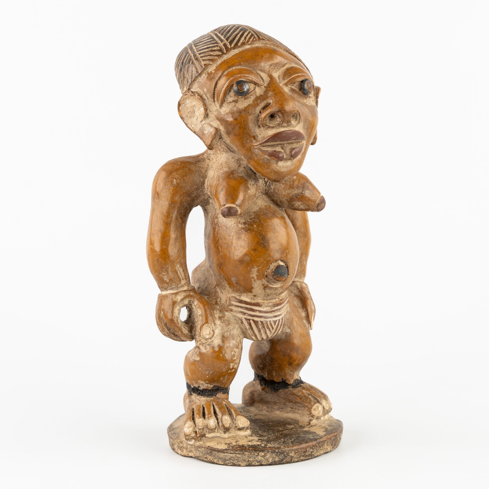 An African fertility figurine, terracotta, Yoruba Ibeji style. (1 of 10)