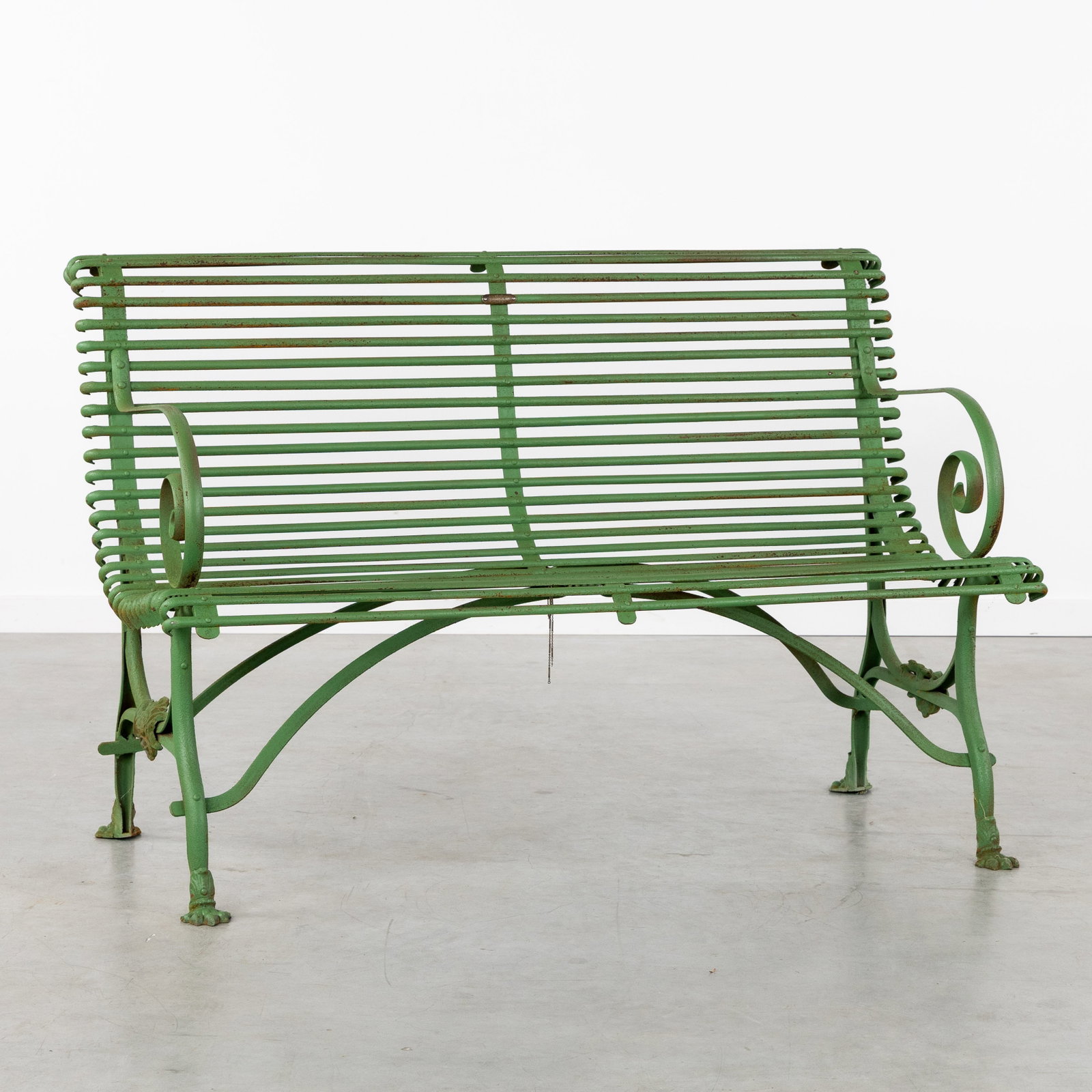 A Green patinated metal garden bench with armrests. (1 of 8)