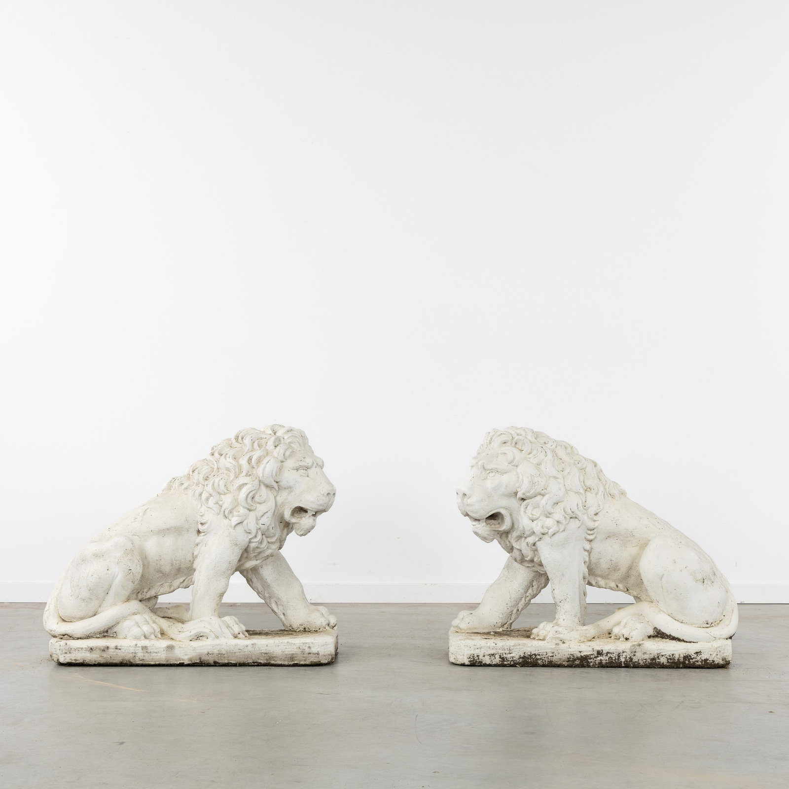 A Pair of decorative garden statues of Seated Lions, patinated concrete, 20th C. (1 of 8)