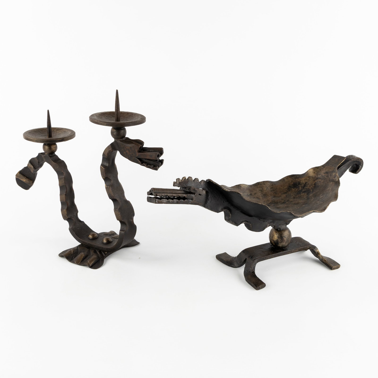 A Brutalist wrought iron candlestick and vide poche, Dragon and Crocodile, circa 1960.: A Brutalist wrought iron candlestick and vide poche, Dragon and Crocodile, circa 1960. Patinated wrought iron.Candlestick with two candle holders, in the shape of a dragon (H: 30 cm x W: 33 cm x D: 14