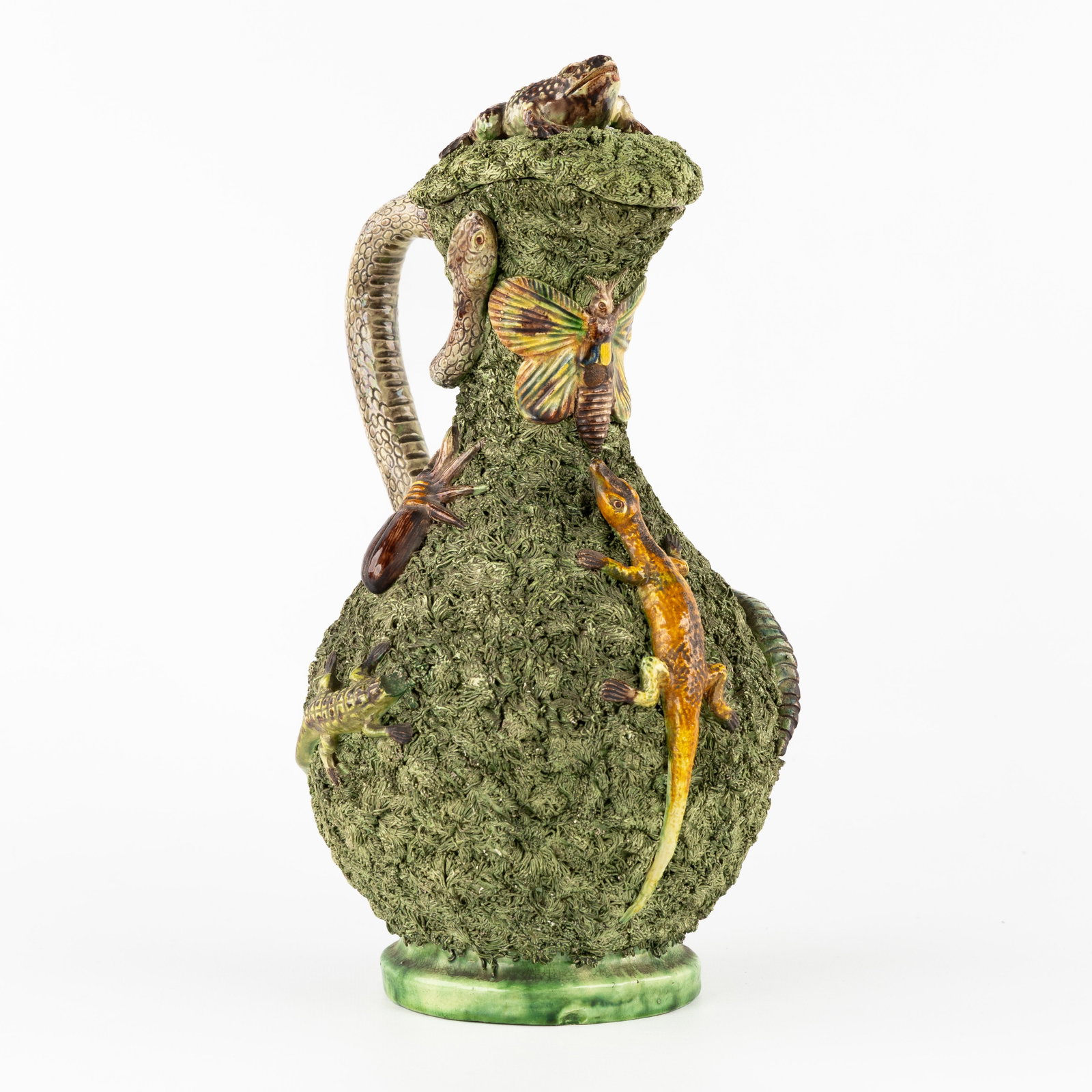 Manuel Mafra (1829-1905) a Palissy-style pitcher with lizards, snake, and insects, glazed ceramic.: Manuel Mafra (1829-1905) a Palissy-style pitcher with lizards, snake, and insects, glazed ceramic. Glazed ceramic, Portuguese faience.Pitcher decorated with sculptured lizards, stag beetle, butterfly,