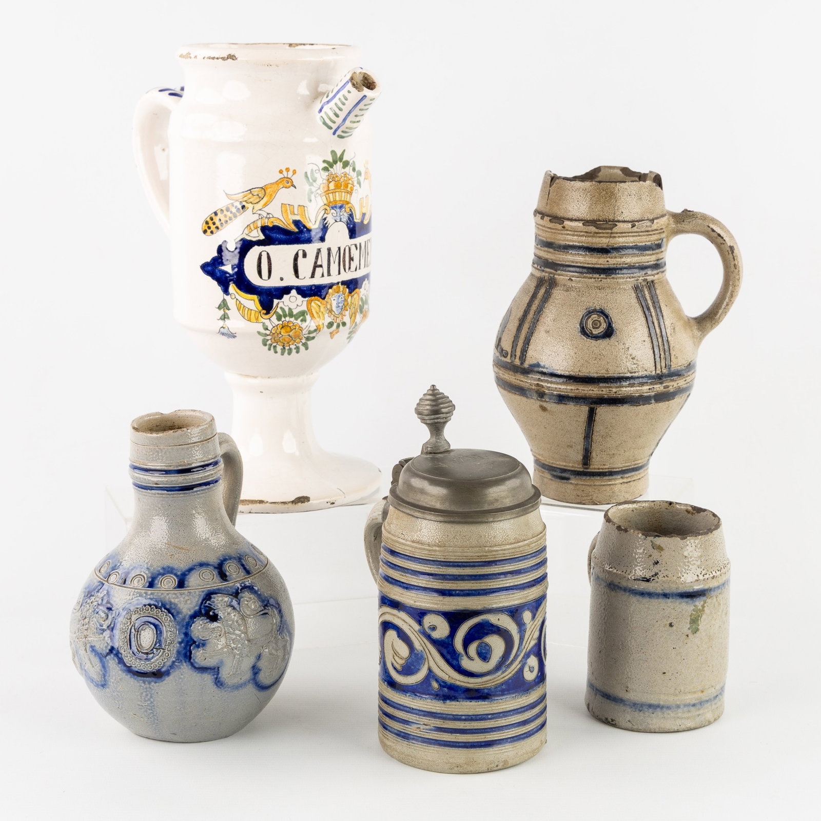 An Delftware apothecary jug 'O. Camoemeli' (19th C.) and four Westerwald stoneware jugs (18th/19th (1 of 8)