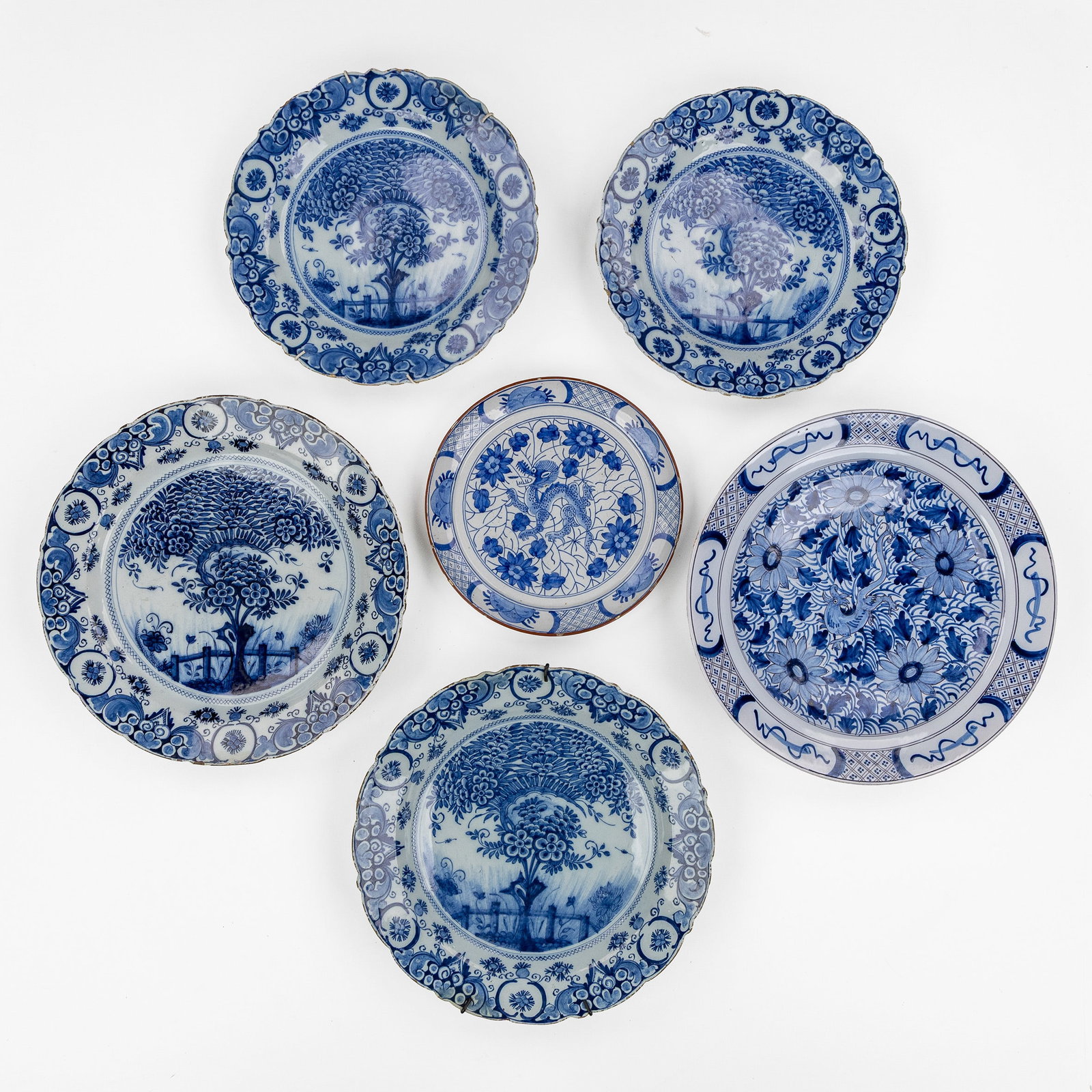 Six Delft plates, De Porceleyne Bijl and others, Blue and white Delft earthenware, 18th C.: Six Delft plates, De Porceleyne Bijl and others, Blue and white Delft earthenware, 18th century. Delft earthenware, blue and white.A pair of plates with tea tree decoration, marked for De Porceleyne B