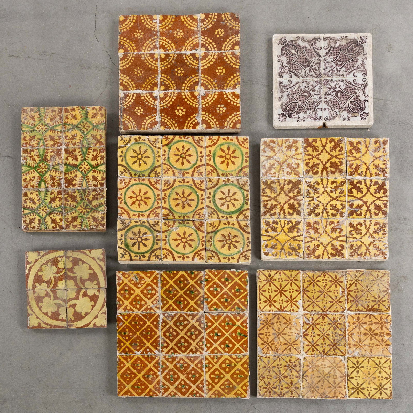 A Collection of Flemish hearth tiles with slip decoration, West Flanders and Northern France, 18th: A Collection of Flemish hearth tiles with slip decoration, West Flanders and Northern France, 18th century. Glazed earthenware with slip decorations.Kortrijk, two tile panels with four and nine tiles 