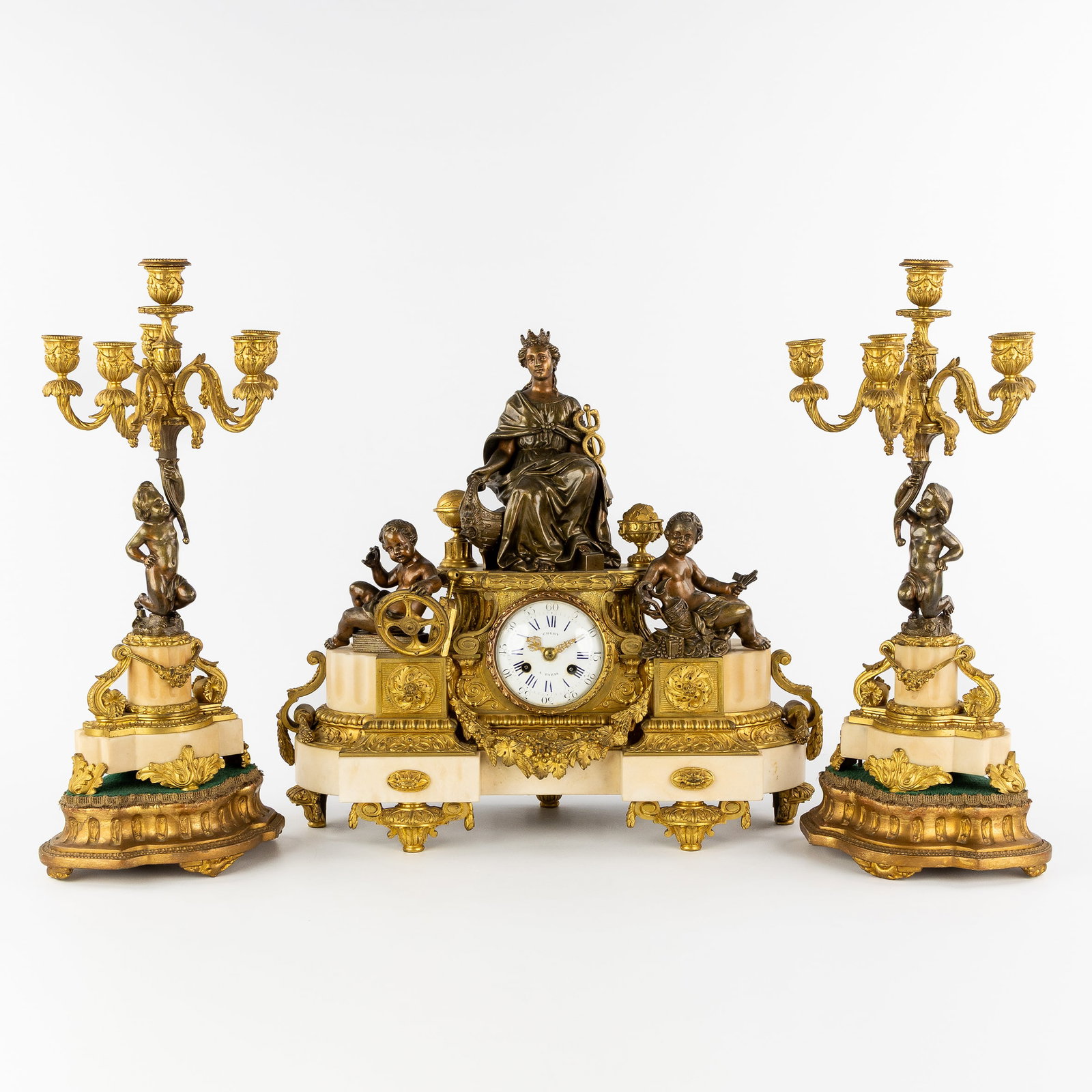 A three-piece garniture clock and candelabra, gilt bronze mounted on Carrara marble. Allegory of (1 of 12)