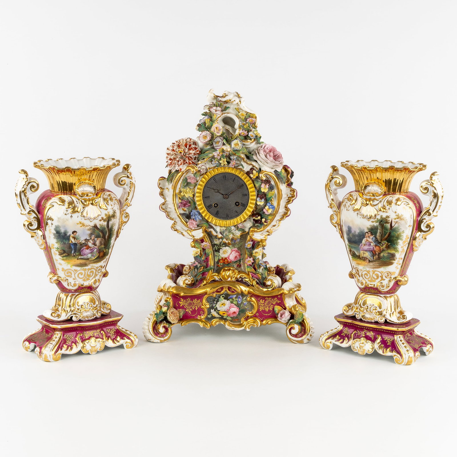 Jacob Petit, Vieux Paris, a three-piece porcelain mantel garniture, clock and vases, florally (1 of 10)