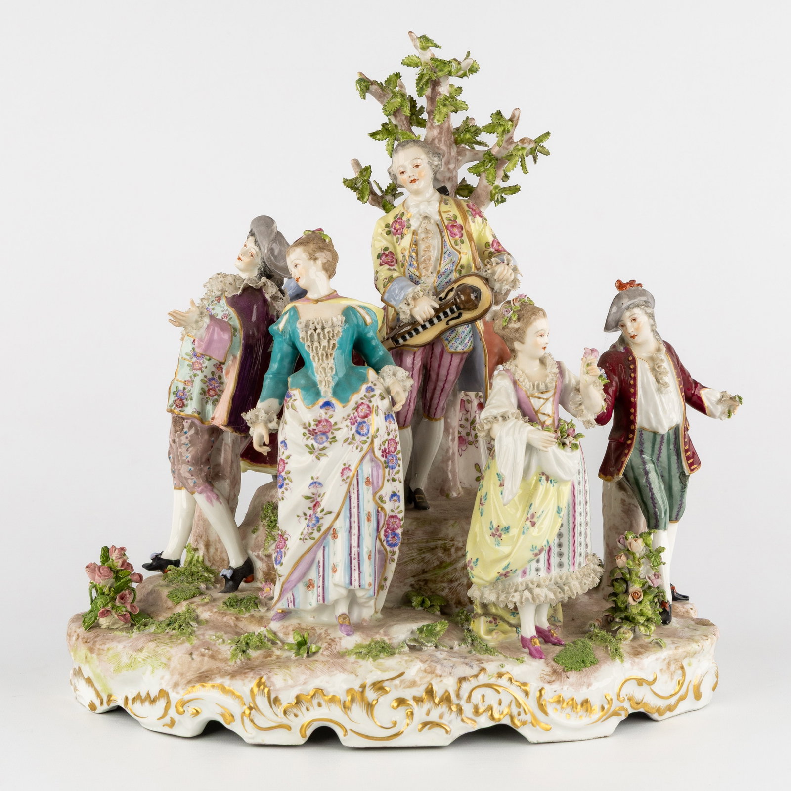 Samson, a large porcelain group or centerpiece, 'Feast with Hurdy-Gurdy', France, 20th C.: Samson, a large porcelain group or centerpiece, 'Feast with Hurdy-Gurdy', France, 20th century. Polychrome porcelain, finished with porcelain lace. Depiction of a musician with a hurdy-gurdy by a tree