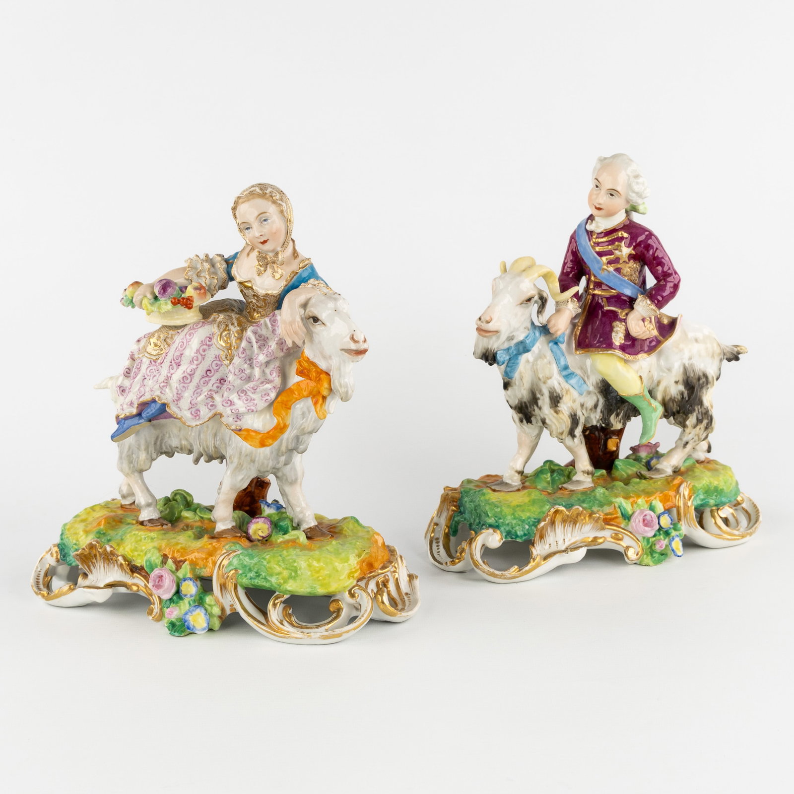 Saxon porcelain, a pair of Meissen style groups of a nobleman and lady on a goat, Rococo style, (1 of 8)