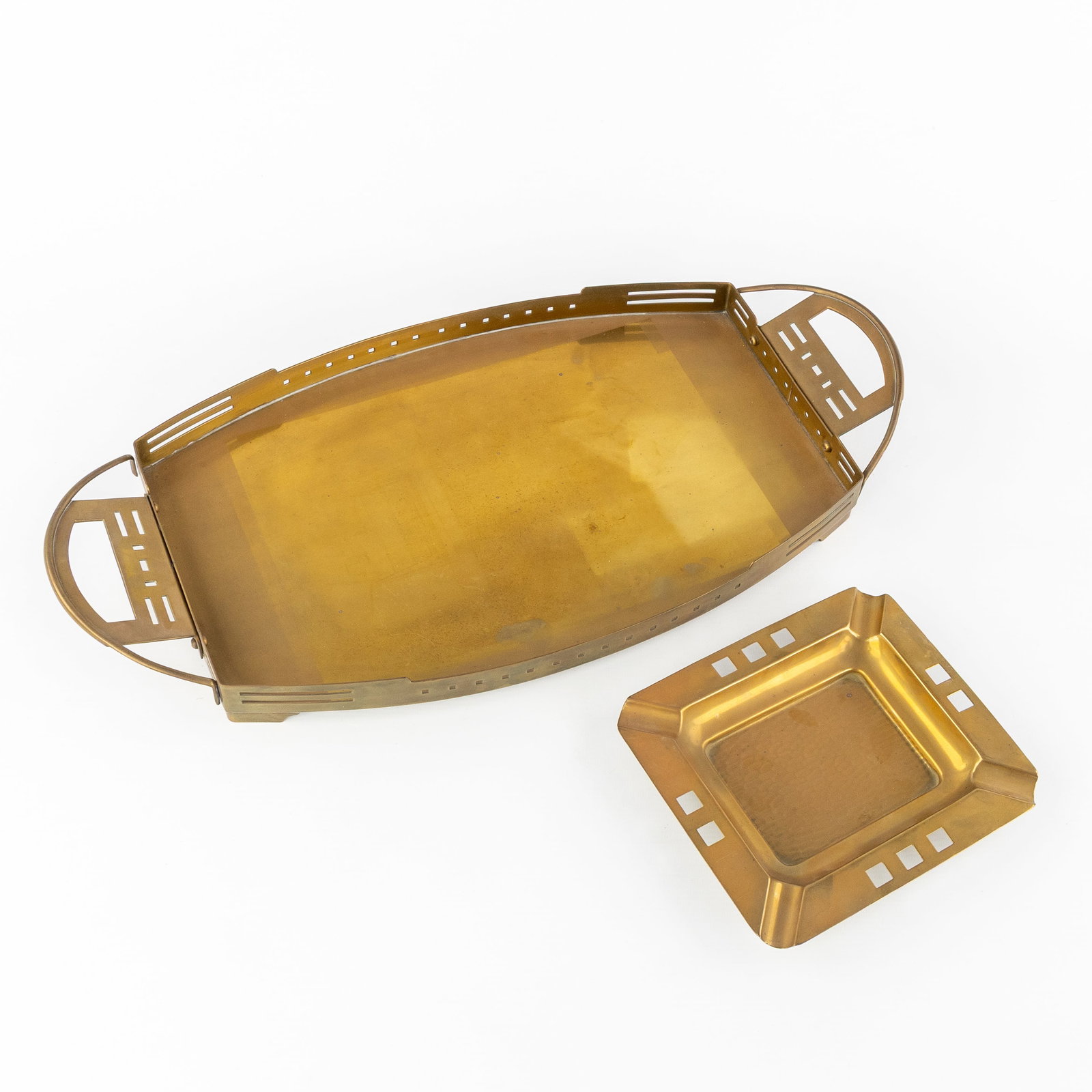 Gustave Serrurier Bovy (1858-1910) (Attr.) a two-handled serving platter and a vide-poche,: Gustave Serrurier Bovy (1858-1910) (Attr.) a two-handled serving platter and a vide-poche, copper/brass, Art Nouveau, circa 1910. Copper/brass.Attributed to Gustave Serrurier Bovy. Two