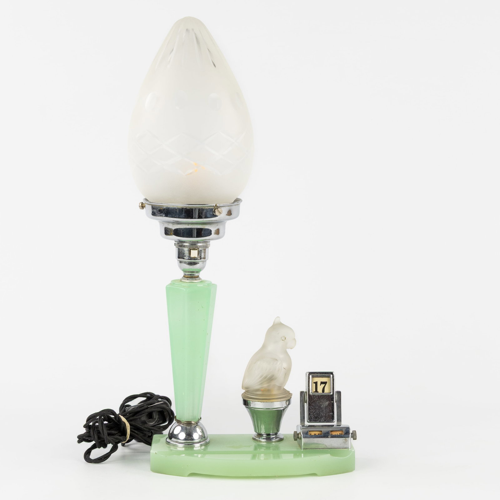 A Mint green Art Deco table lamp with Calendar. Bakelite, chrome-plated metal, and frosted glass.: A Mint green Art Deco table lamp with Calendar. Bakelite, chrome-plated metal, and frosted glass. Art Deco, circa 1940. Mint green Bakelite/phenolite, chrome-plated metal, and frosted glass.Table lamp