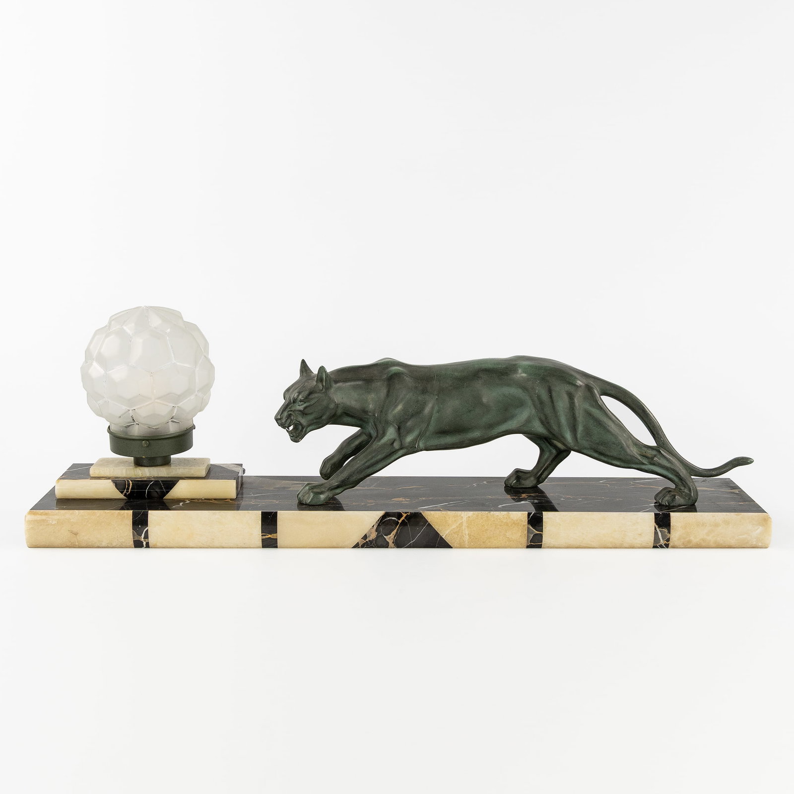An Art Deco table lamp with a panther sculpture, patinated spelter, marble, and glass. Art Deco, (1 of 7)