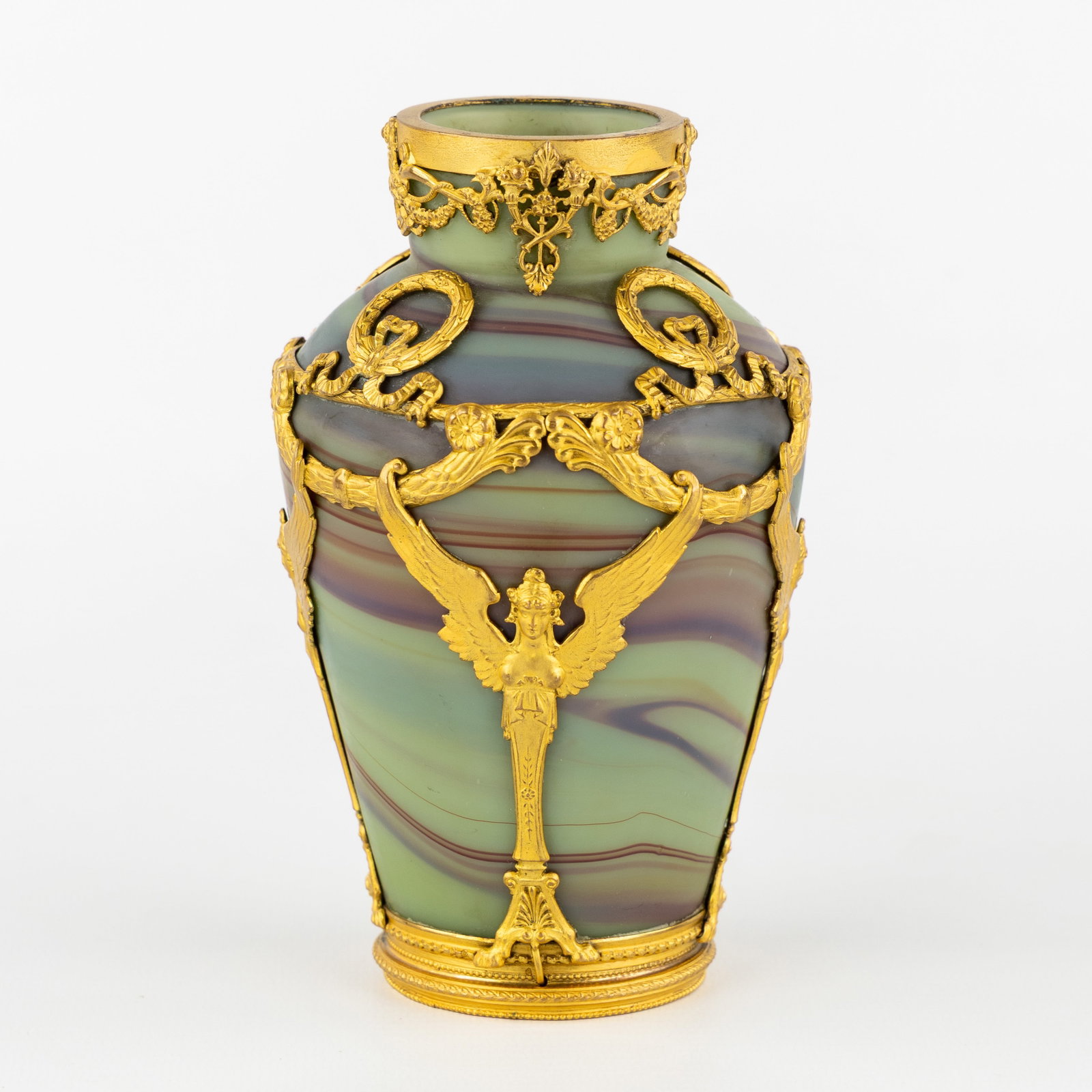 Sèvres (attributed), a small vase in agate glass, mounted with gilded bronze in the Empire: Sèvres (attributed), a small vase in agate glass, mounted with gilded bronze in the Empire style. Circa 1900. Agate glass mounted with gilded bronze in the Empire style.Richly decorated with cary