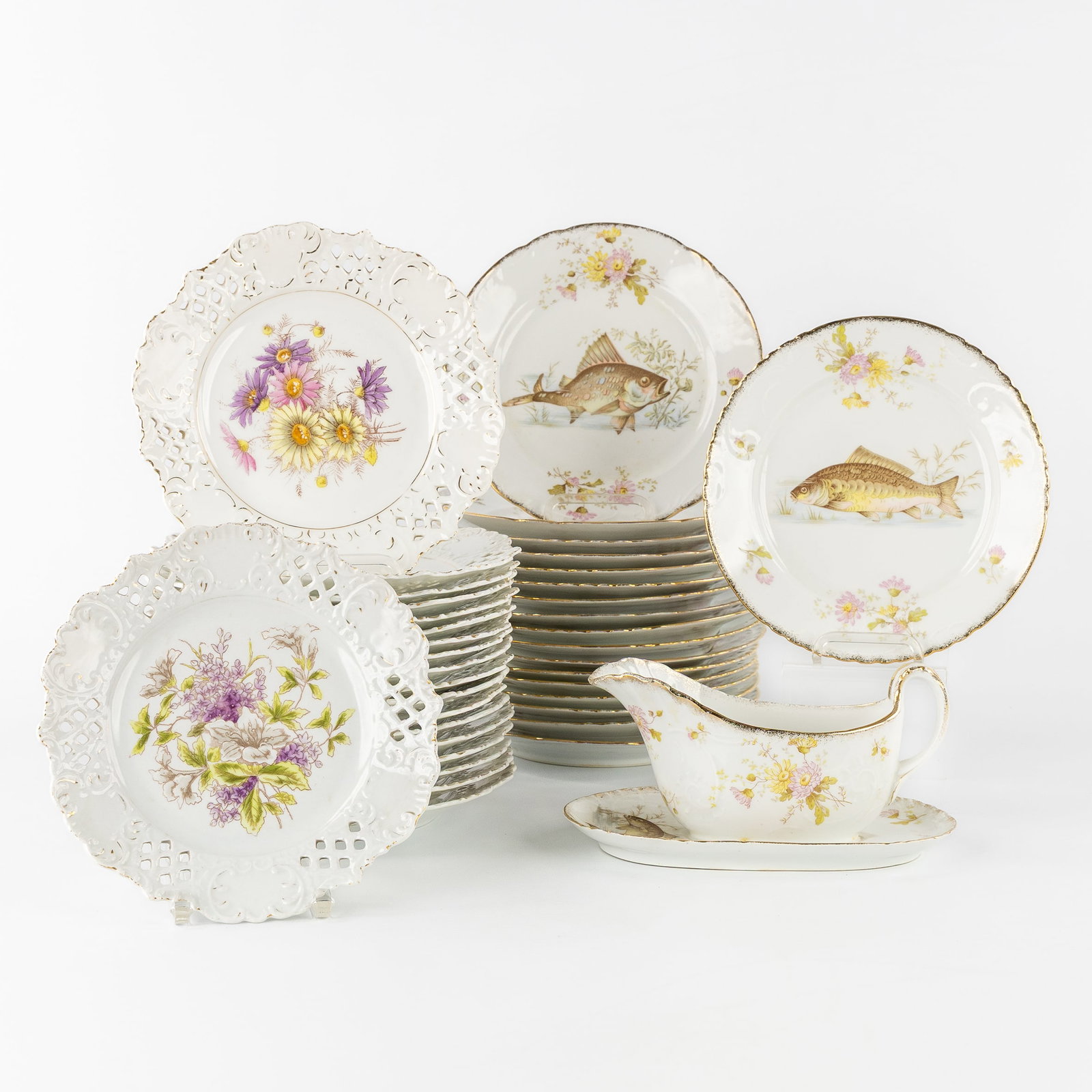 A 37-piece composed porcelain dinner service, floral decor with fish and openwork finish, probably (1 of 15)