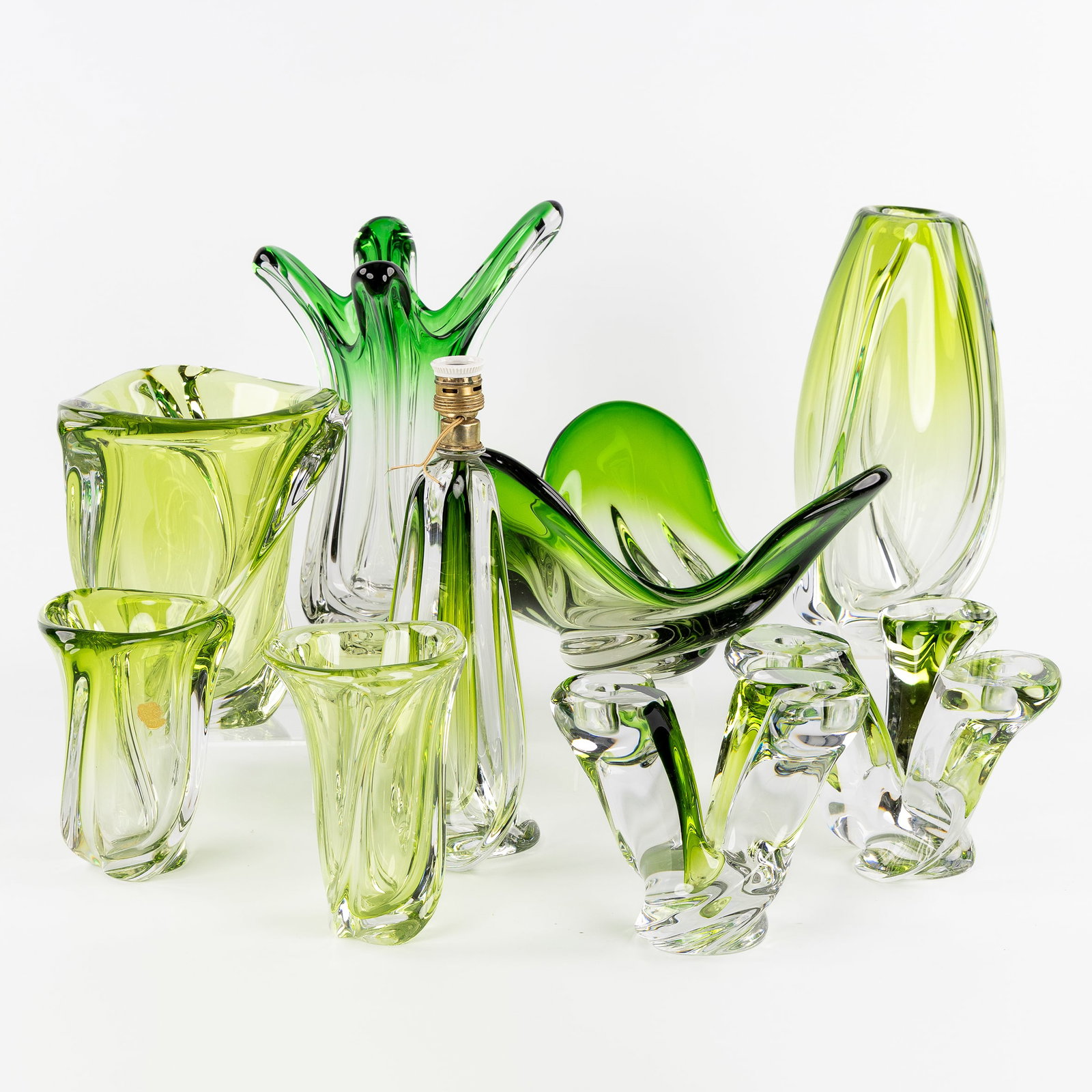 Val Saint Lambert, a collection of 9 pieces of green-coloured crystal, with 5 vases, 2 candlesticks, (1 of 13)