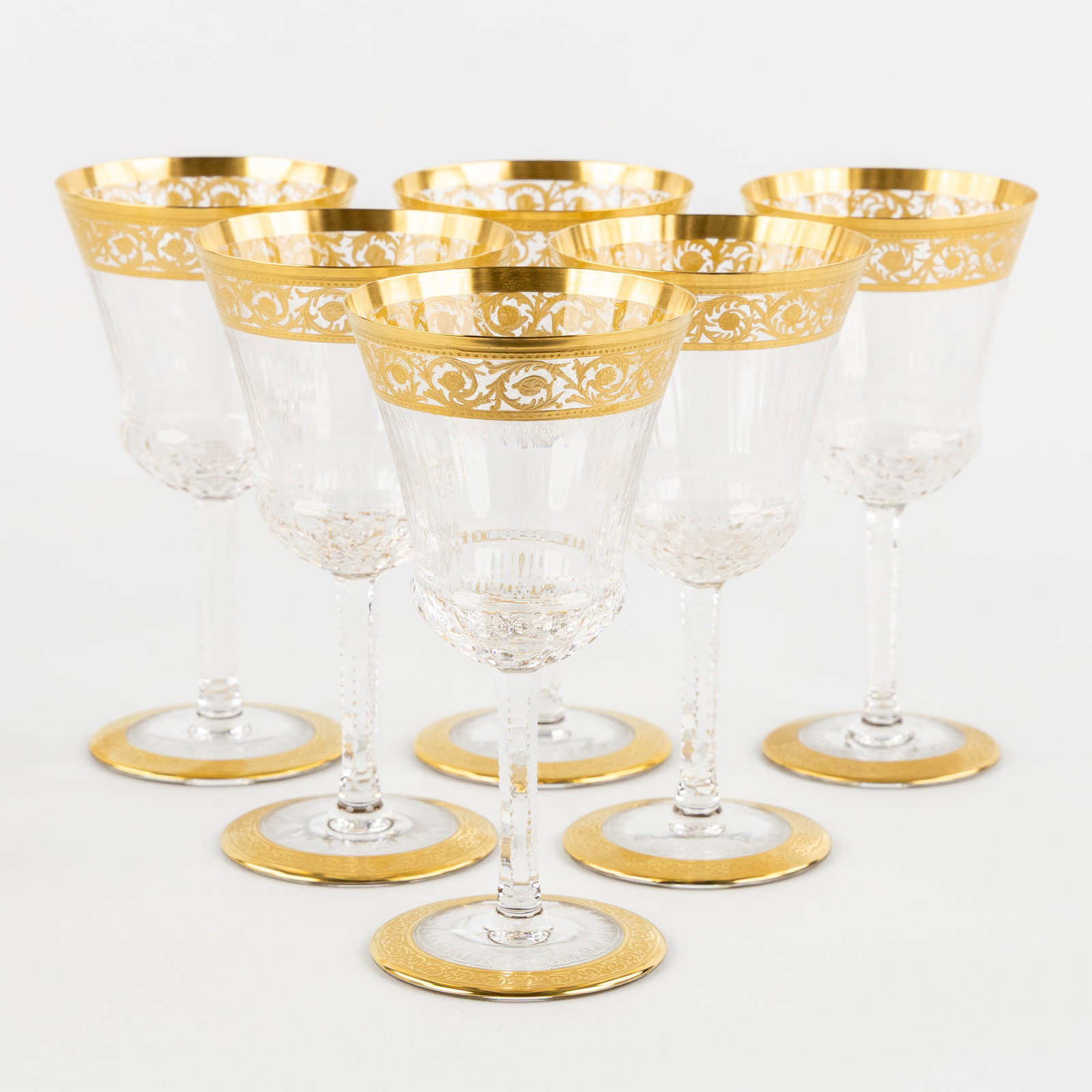 Saint Louis, 'Thistle Gold', a set of 6 water glasses, engraved decorations and etched gold: Saint Louis, 'Thistle Gold', a set of 6 water glasses, engraved decorations and etched gold decorations. Six white wine glasses, cut and etched crystal.Decor 'Thistle Gold'.All signed 'Saint Louis -