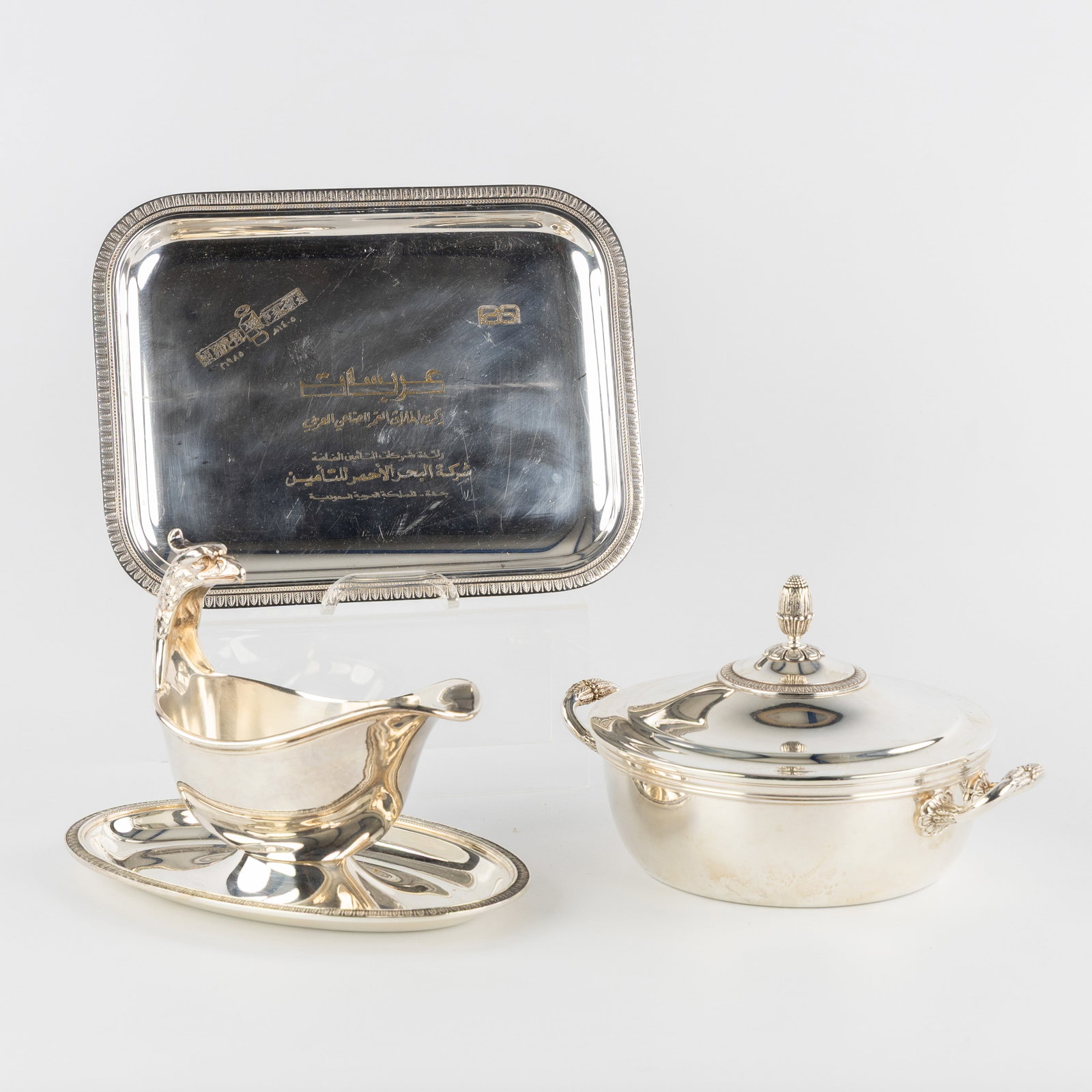 Christofle, Malmaison, Gallia, a sauce boat, covered bowl, and small serving tray, silver-plated: Christofle, Malmaison, Gallia, a sauce boat, covered bowl, and small serving tray, silver-plated metal. Silver-plated metal.Three pieces, Malmaison model. A sauce boat with eagle's hea