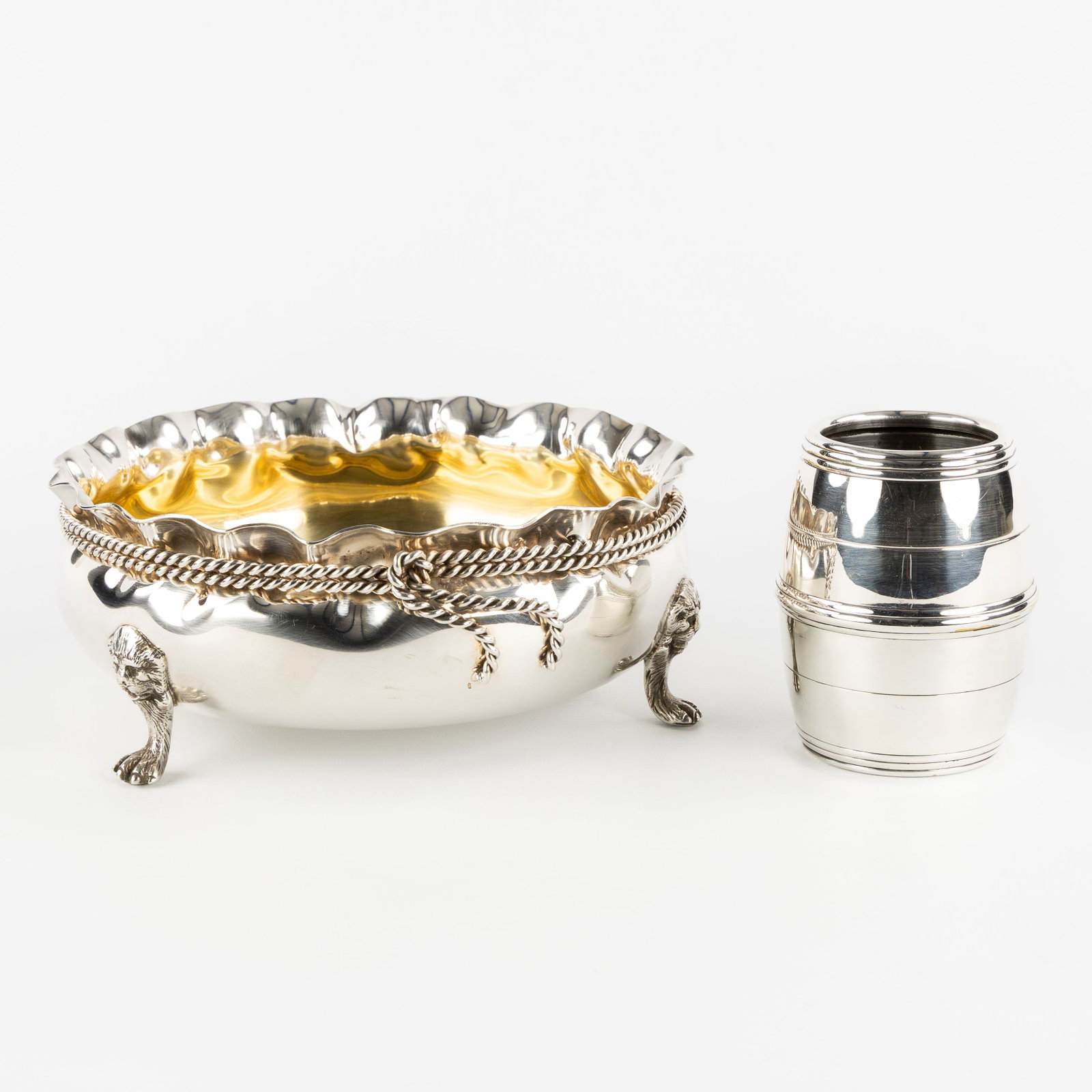 Christian Dior, a silver-plated bowl on lion's paws and a small barrel-shaped vase. (1 of 8)
