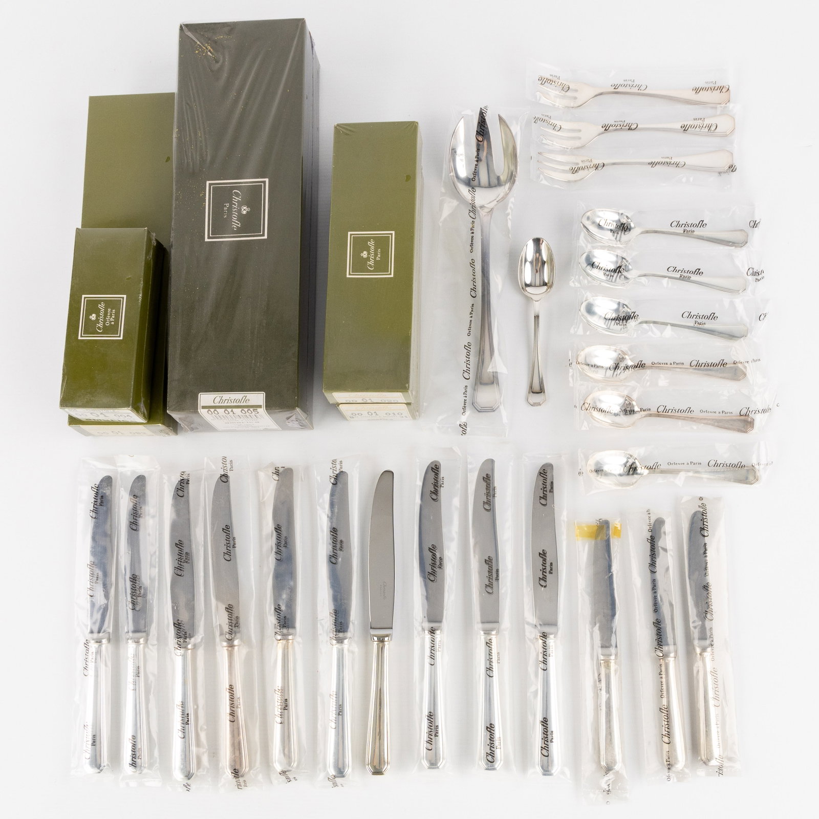 Christofle, America, Luc Lanel, a 62-piece cutlery set, silver-plated metal, mostly new and sealed.: Christofle, America, Luc Lanel, a 62-piece cutlery set, silver-plated metal, mostly new and sealed. Silver-plated metal.Model America, design by Luc Lanel 10 large knives, 9 of which a