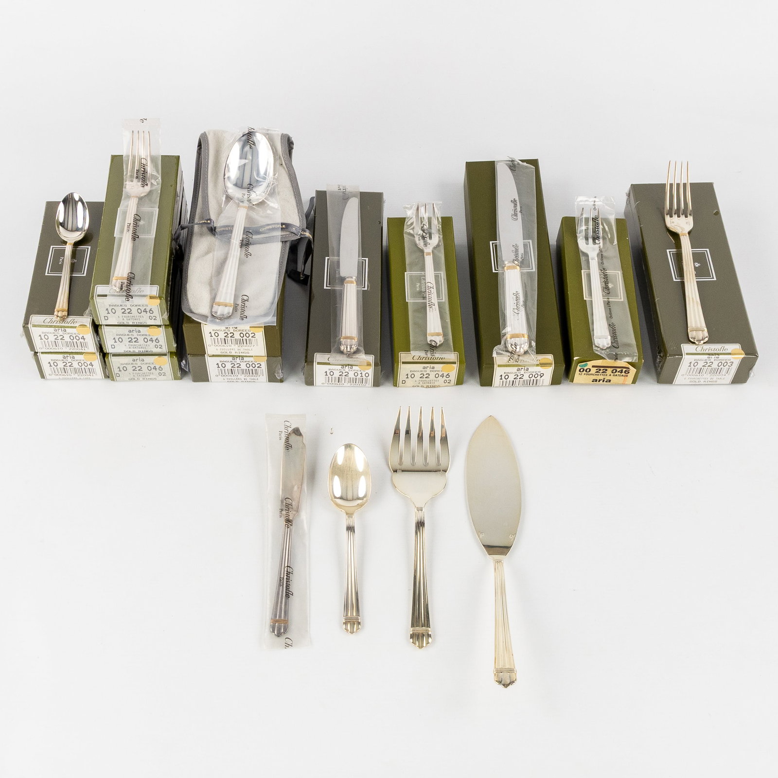 Christofle, Aria Doré, a 106-piece silver-plated cutlery set and accessories.: Christofle, Aria Doré, a 106-piece silver-plated cutlery set and accessories. Silver-plated with a gold-plated ring: 12 large forks, new in their sealed box.8 large knives, 6 of w
