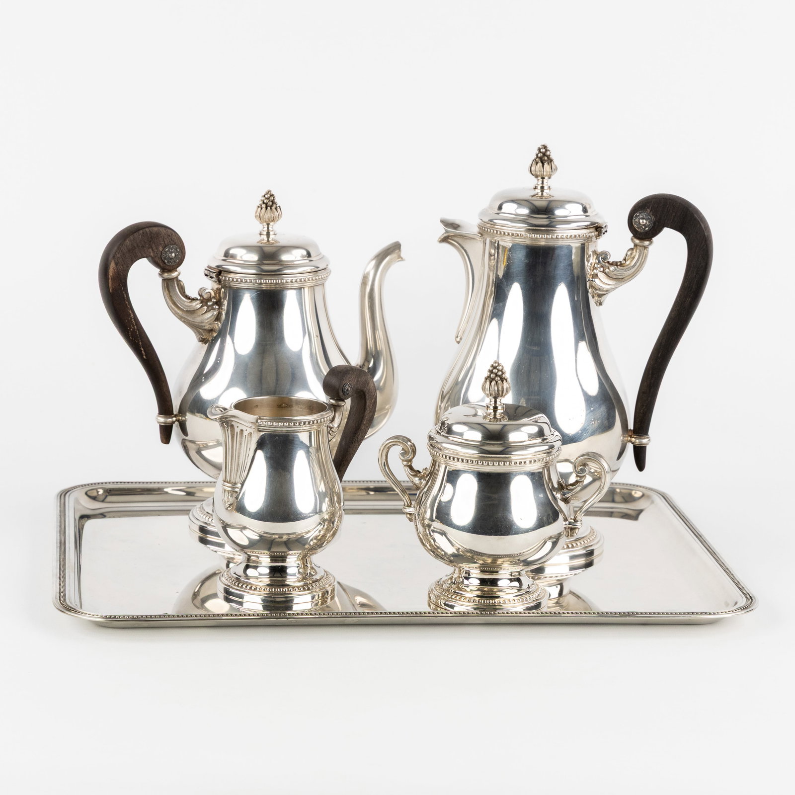 Christofle, ‘Perles’, a 5-piece coffee and tea set. Silver-plated metal.: Christofle, ‘Perles’, a 5-piece coffee and tea set. Silver-plated metal. Coffee potTeapotMilk jugSugar bowlRectangular serving platter All
